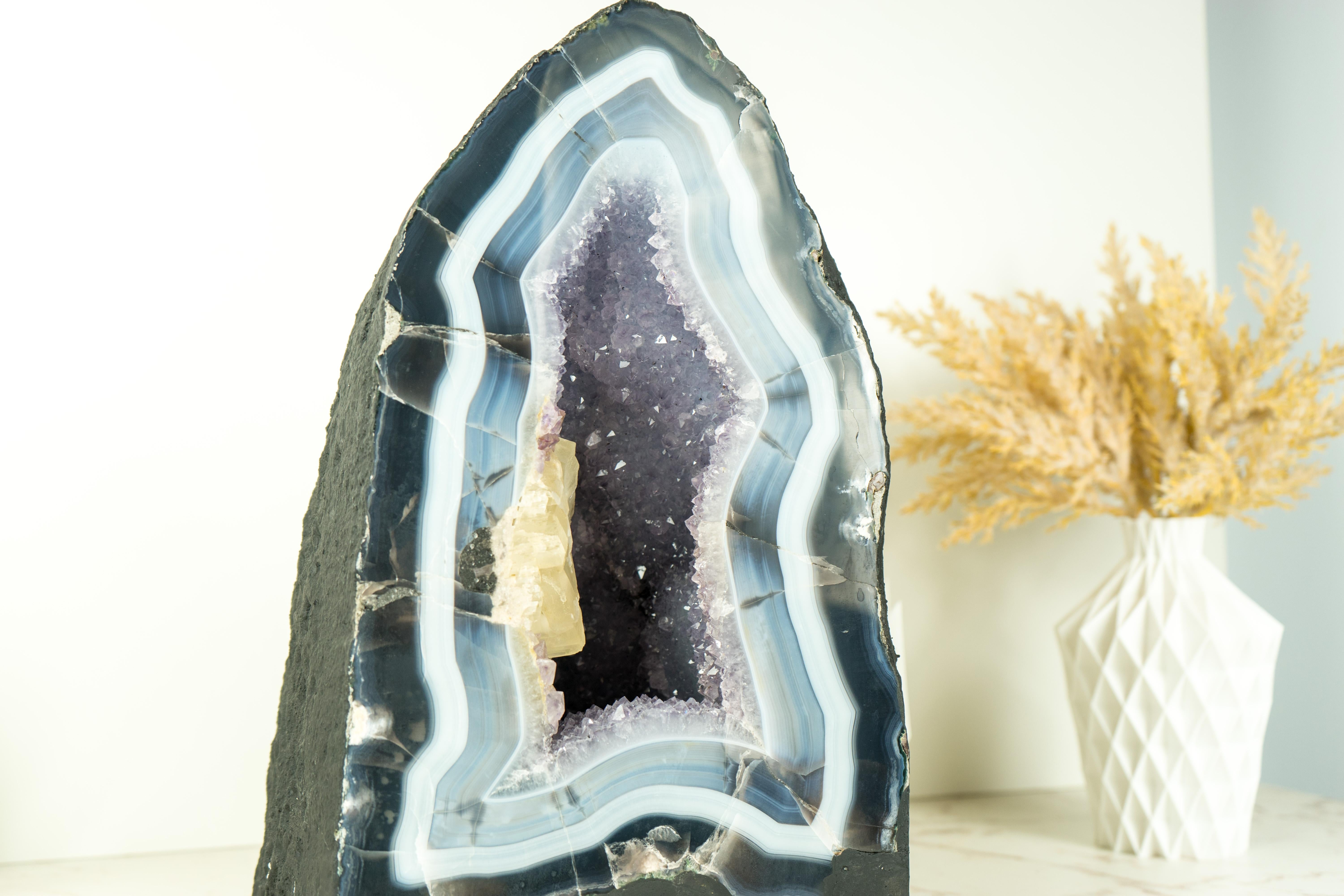 An Agate Geode that is unlike any we have ever encountered. While agate geodes are not rare, this particular specimen stands out as superior. Its bold, distinctively large agate bands encircle the entire piece, creating a zonation indicative of