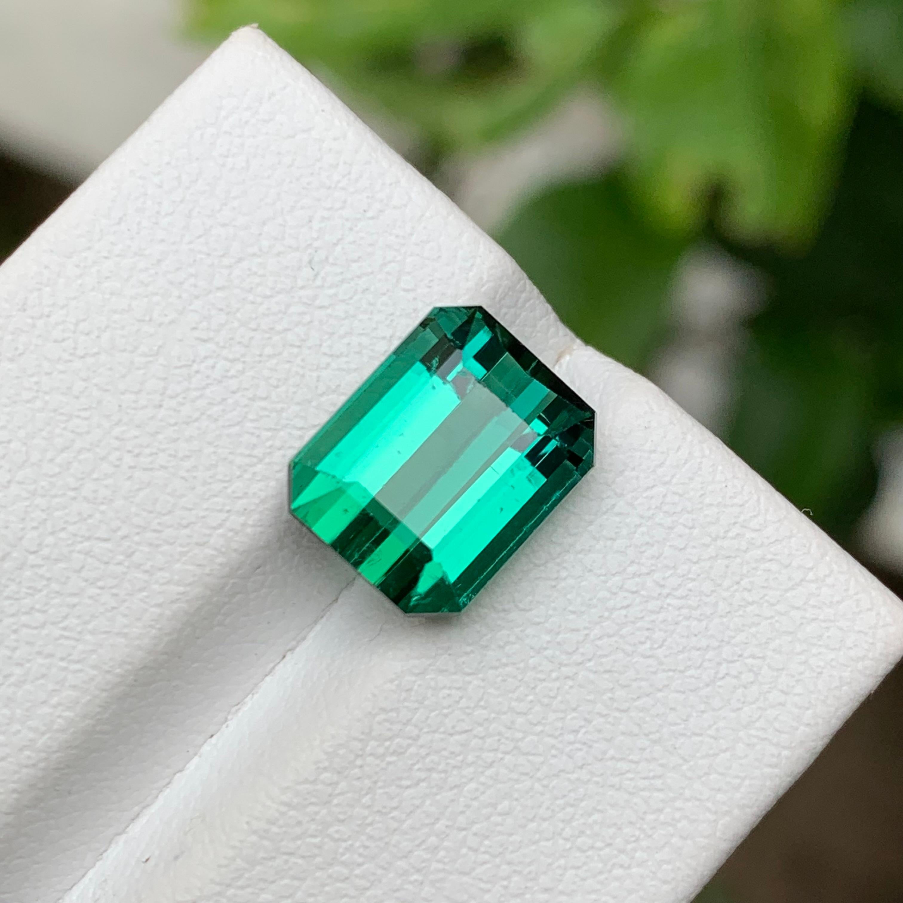 GEMSTONE TYPE: Tourmaline
PIECE(S): 1
WEIGHT: 5.65 Carats
SHAPE: Emerald 
SIZE (MM): 10.68 x 8.59 x 6.95
COLOR: Bluish Green
CLARITY: Slightly Included Approx 95% Eye Clean
TREATMENT: None
ORIGIN: Afghanistan 🇦🇫 
CERTIFICATE: On demand
(if you