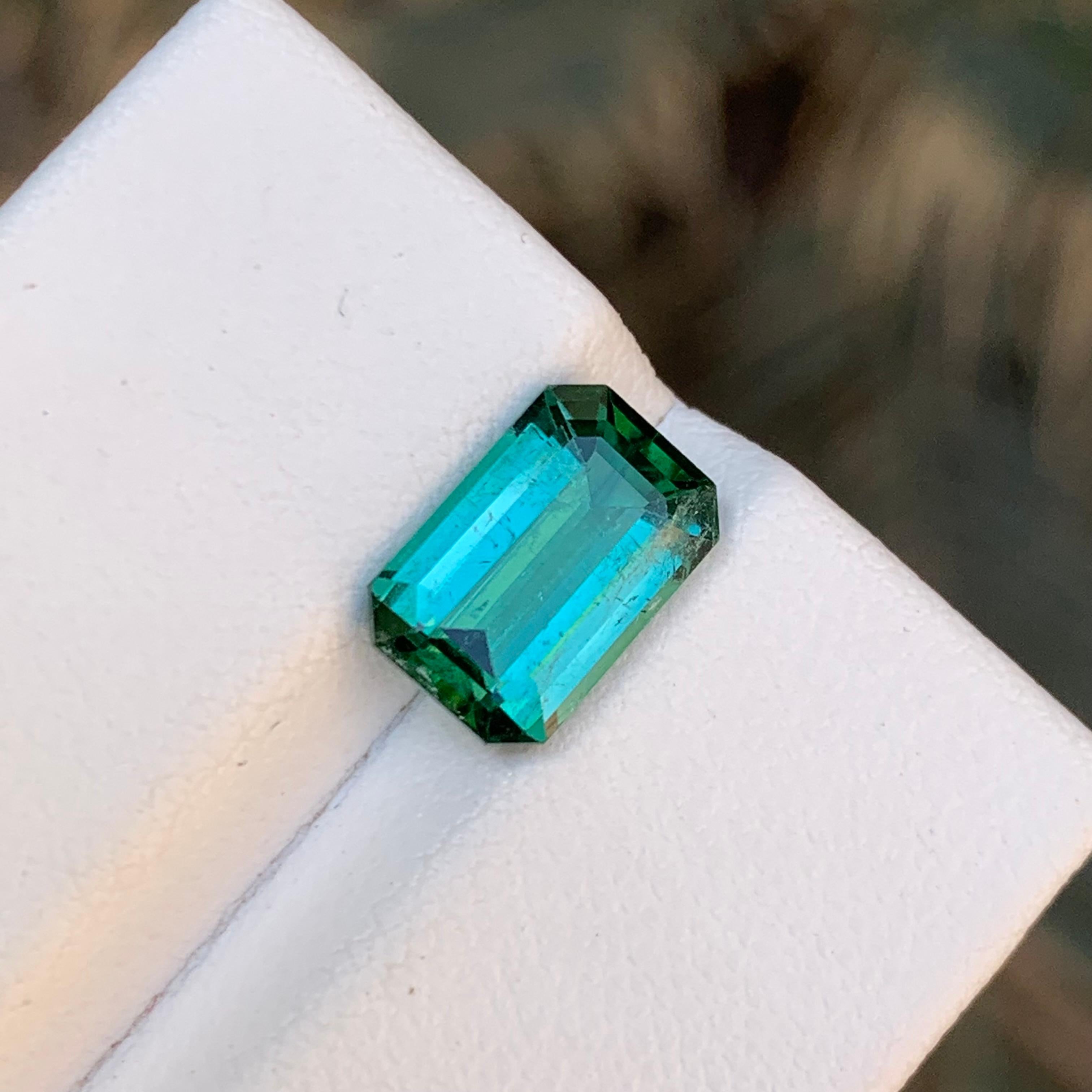GEMSTONE TYPE: Tourmaline
PIECE(S): 1
WEIGHT: 2.70 Carats
SHAPE: Emerald
SIZE (MM): 10.17 x 6.76 x 4.47
COLOR: Bluish Green
CLARITY: Slightly Included 
TREATMENT: None
ORIGIN: Afghanistan
CERTIFICATE: On demand

Indulge in the enchanting allure of