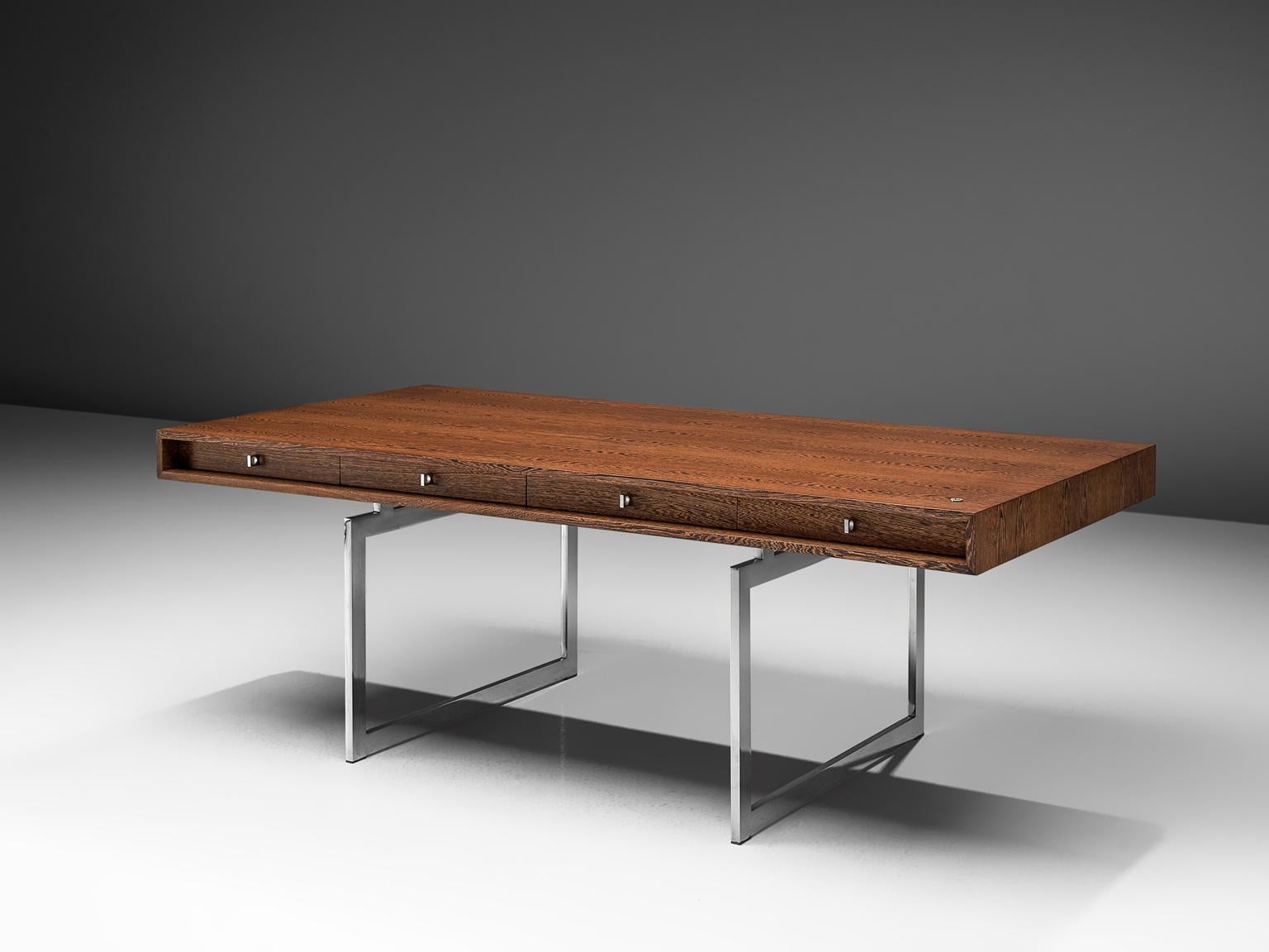 Bodil Kjaer for E. Pedersen & Søn, table model 901, Rosewood and chrome steel, Denmark, 1959.

This freestanding desk in Rosewood is designed by the Danish designer Bodil Kjaer. The desk can be used with multiple purposes, as a writing table, desk