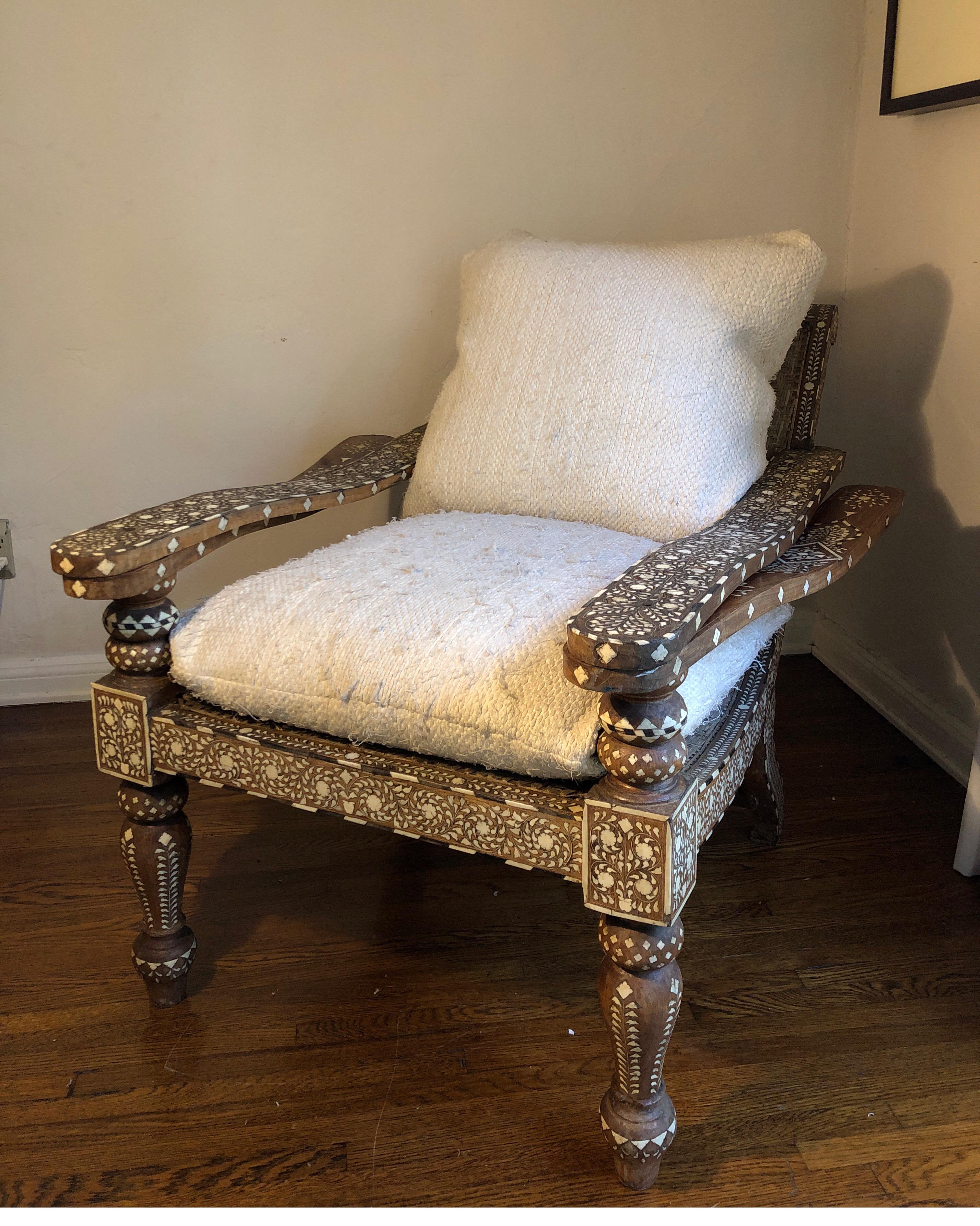 Antique Anglo-Indian chair with rare all-over bone and ebony inlay. 
Two swing out armrests to make it a lounger to raise your legs.

Can seating is in fair condition, but see pics as it has areas that could use repair. Believed to be Rosewood,