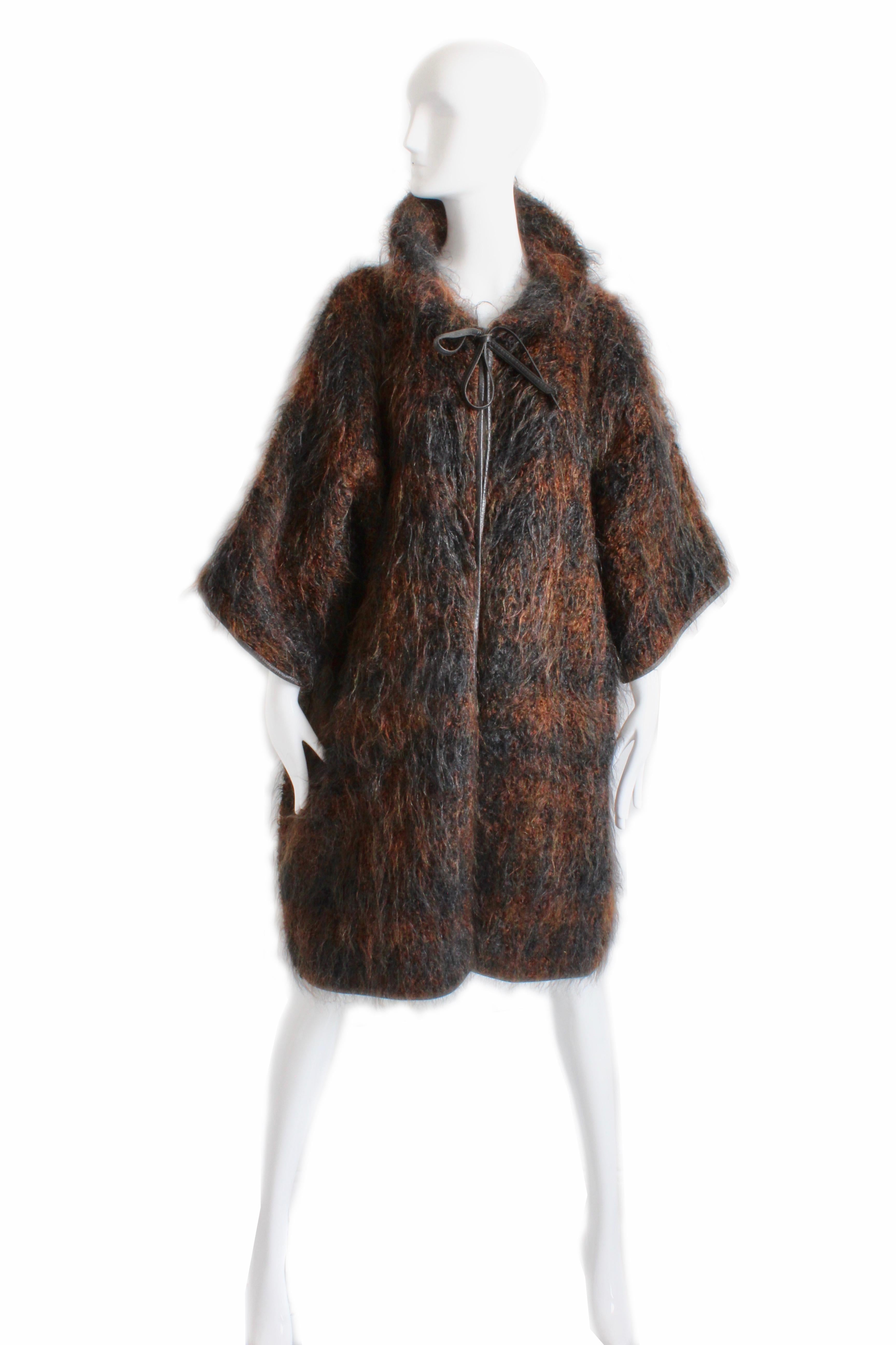 This fabulous woolly mohair coat was designed by Bonnie Cashin during her time at Sills circa 1957. The same style Noh coat that is at the FIDM Museum collection (google search Bonnie Cashin mohair NOH coat FIDM and you'll see it online) and is a
