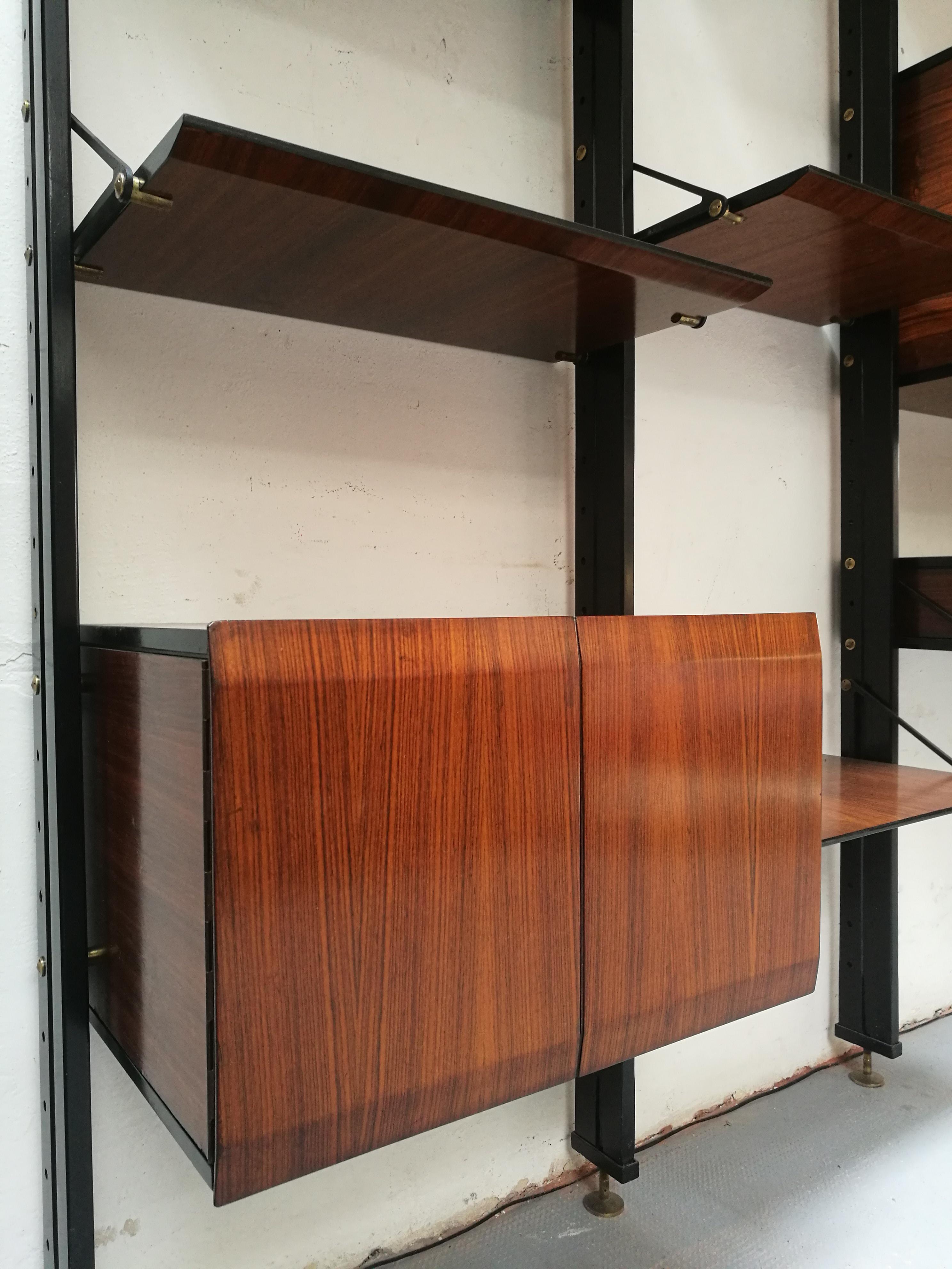 Rare bookcase by Luciano Frigerio di Desio, Milano, 1960s
Italian floor/ceiling bookshelf by Luciano Frigerio Di Desio, Milano, made in rosewood and steel, with solid brass details.
This unique bookshelf is composed by 2 cabinet, 1 bar cabinet, 1