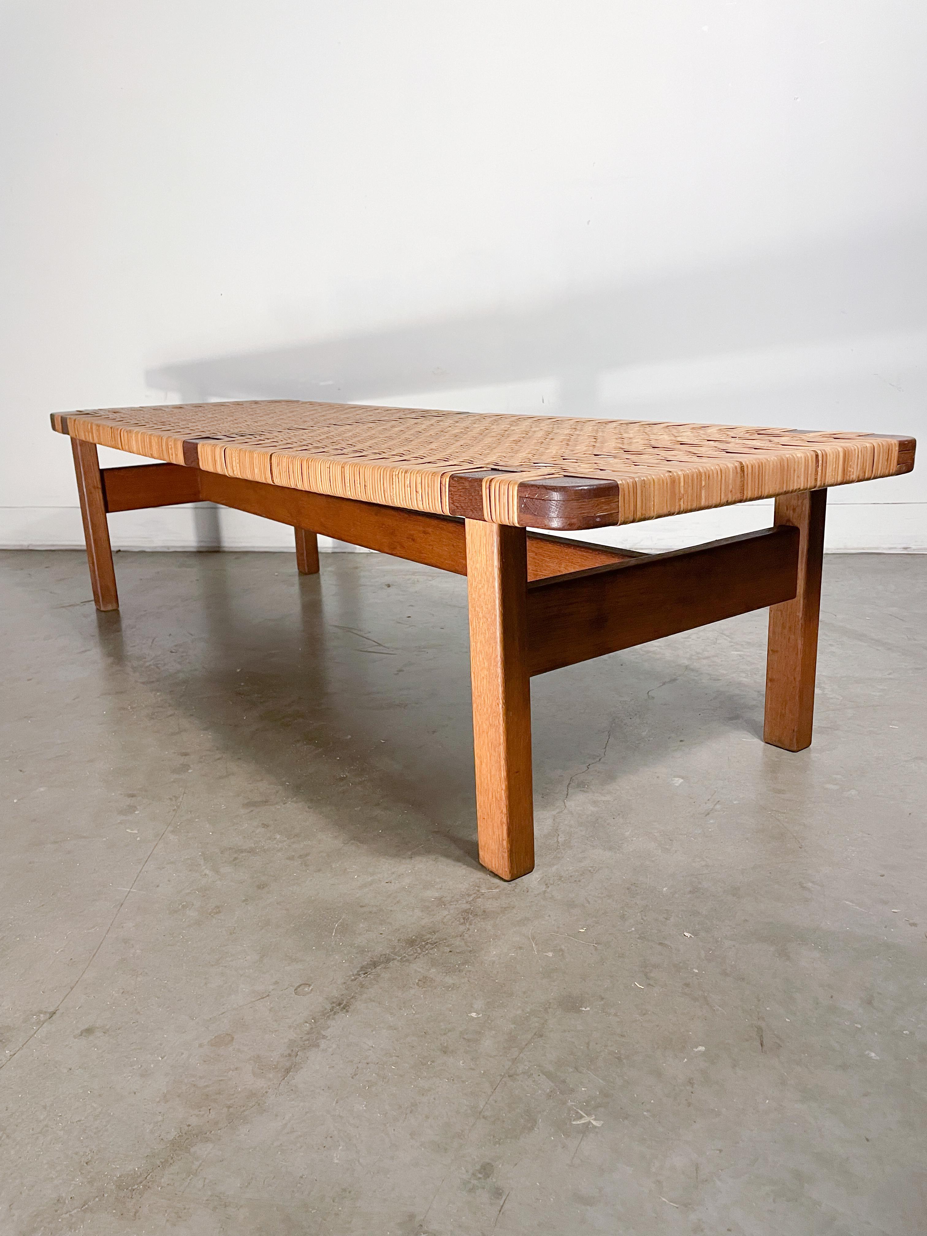 Very rare early bench design by Borge Mogensen known as the 272 model. Featuring Mogensen's fondness for simple, solid lines contrasted with the delicate nature of a woven cane surface, this piece marries the two beautifully. This bench is in good