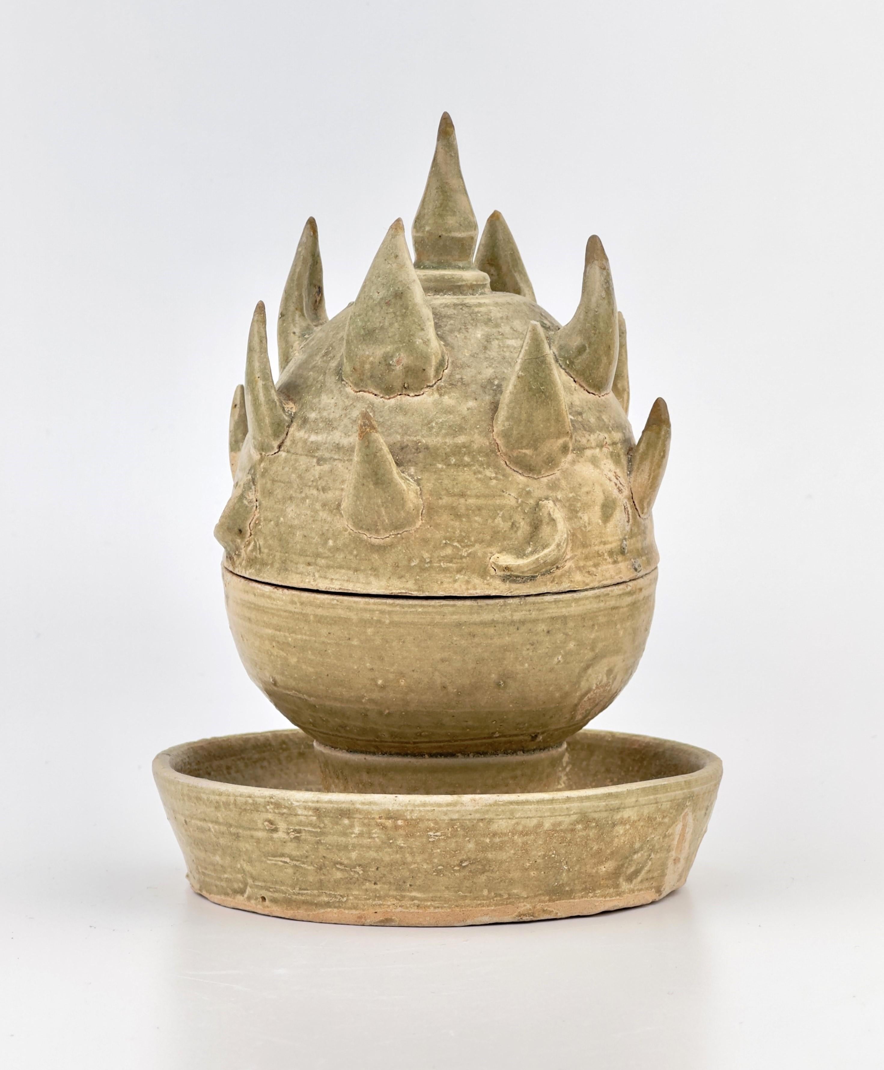 The Boshan incense burner is particularly notable among Han dynasty incense burners for its unique shape. Designed to resemble a mountain or even a mythical mountain, it is characterized by its pointed peaks that rise upwards. These peaks often