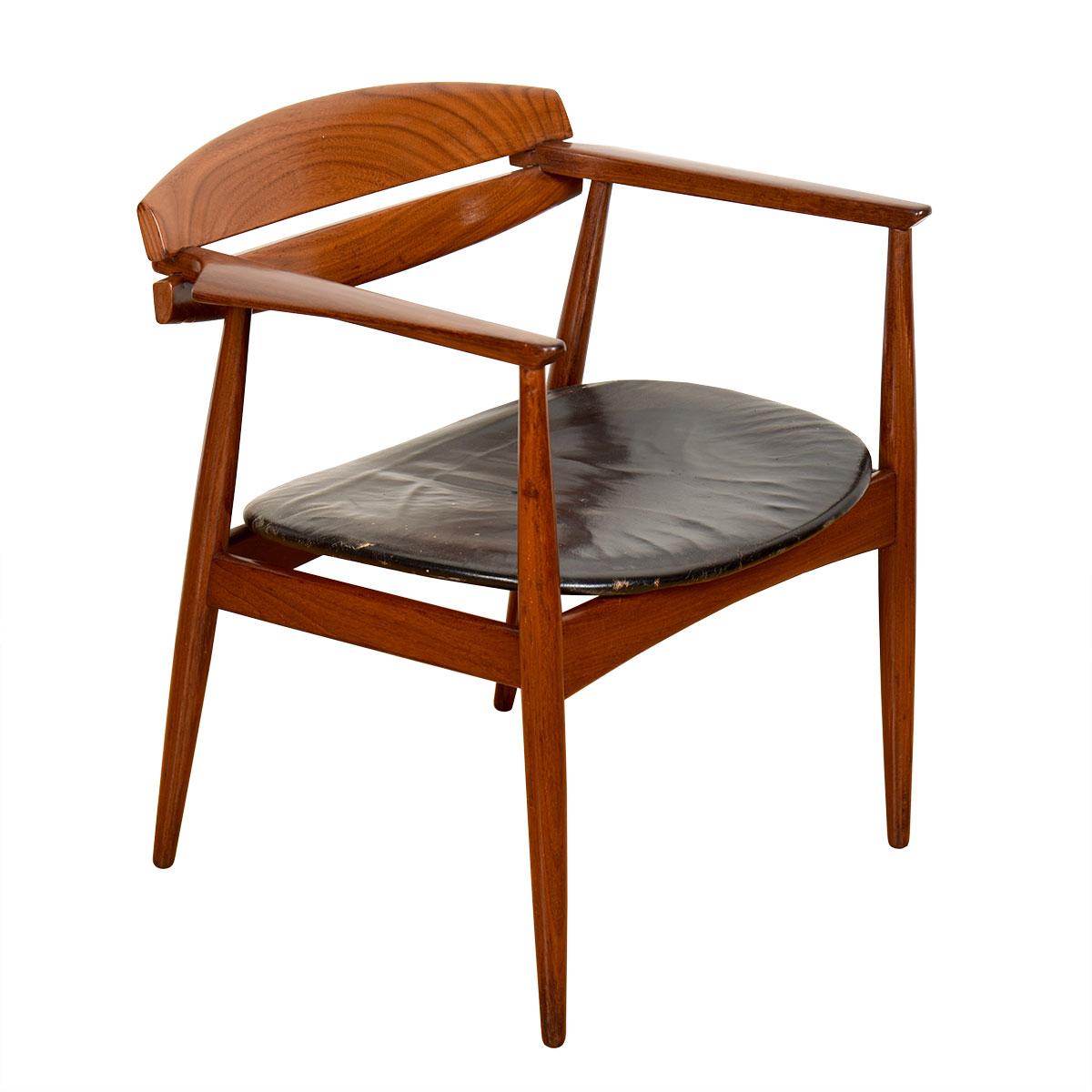 Excellent and scarce armchair by Jorgen Matz and John Sylvester for Bramin of Denmark. 1959 design. Made of afromasia (in the rosewood family) and leather. Lovely sculpted arms and cantilevered joinery where the arms go through the back. Nice wide