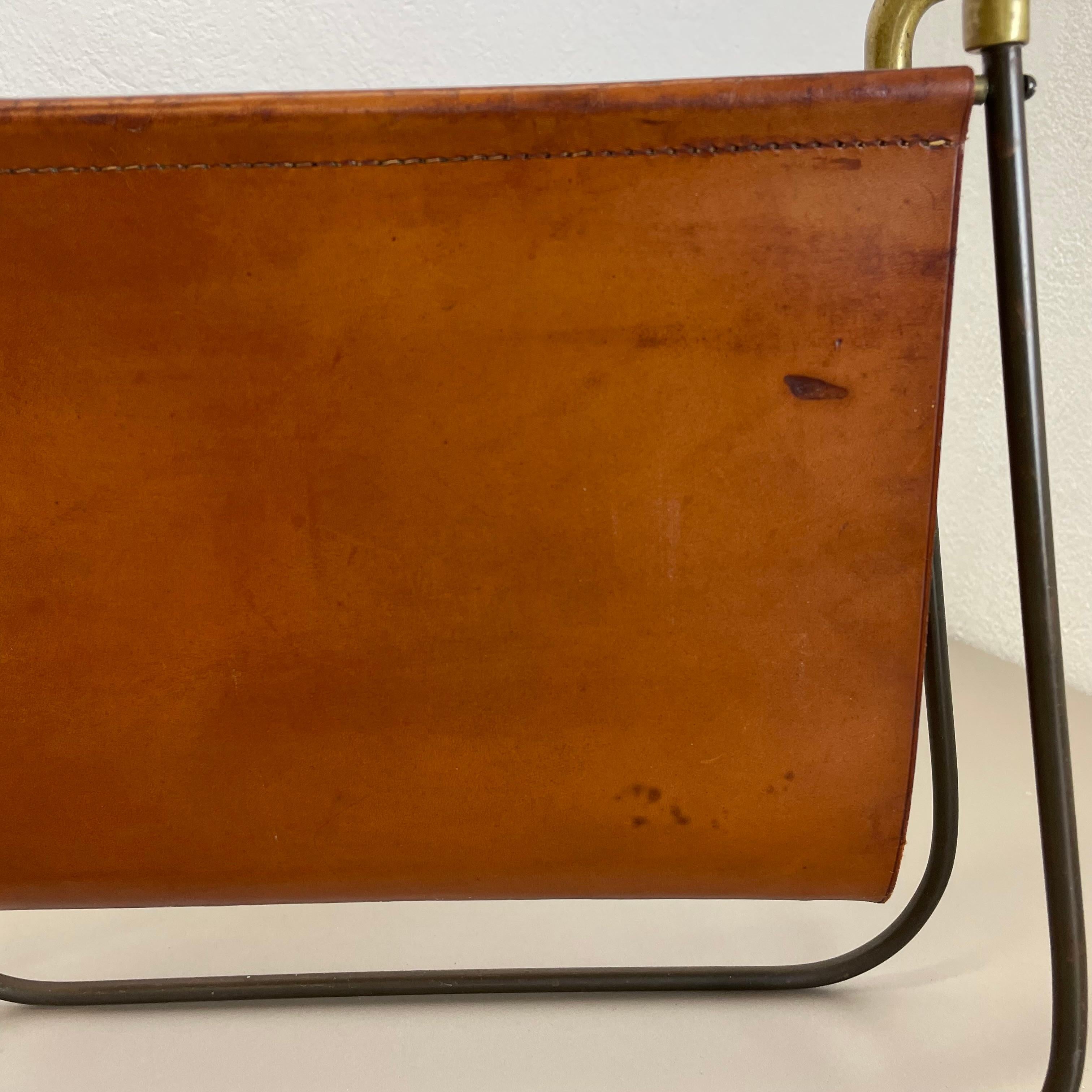 Austrian rare Brass and Brown Leather Magazine Holder Model by Carl Auböck, Austria 1950s For Sale