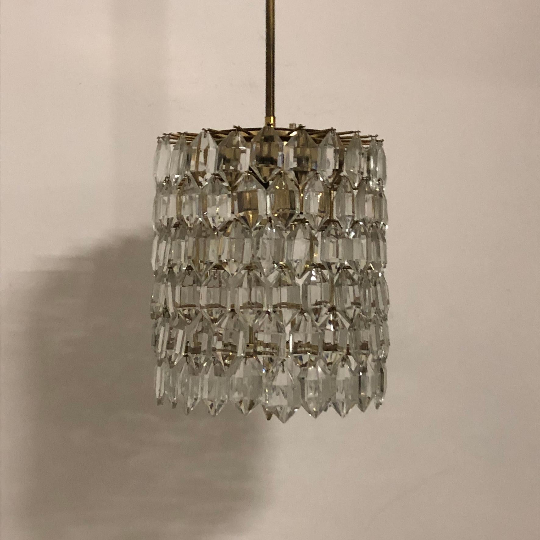 A  mid -century cylindrical glass and brass chandelier by Bakalowits & Sohne, Austria, circa 1960s.
Socket: four x e14 (Edison) for standard screw bulbs.
 