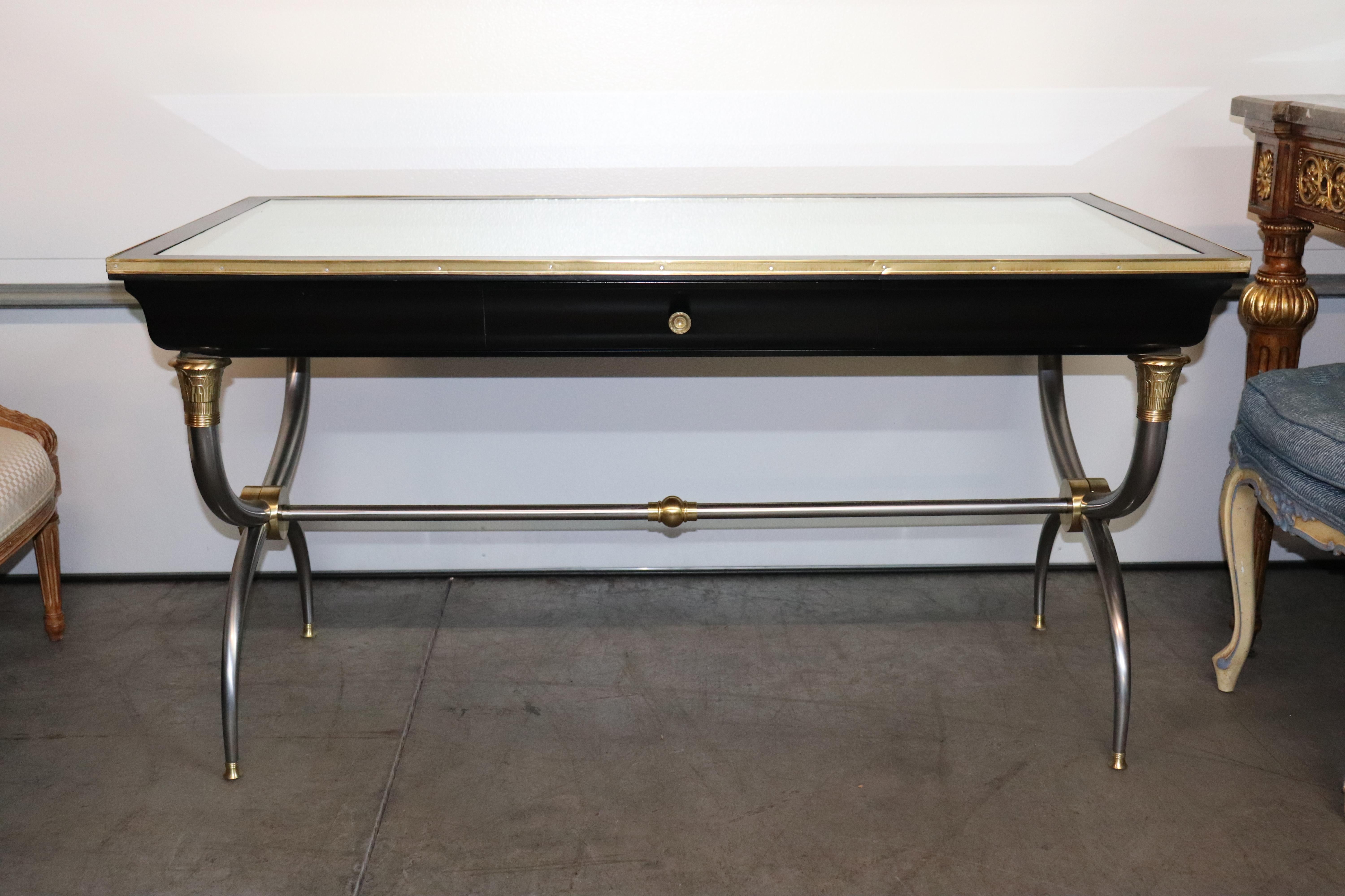 This is a stunning desk that was perhaps made by John Vesey, but we can't say with any degree of certainty. The elements are there, the steel and brass used to create the more average wooden attributes of French Directoire design. The antique-aged