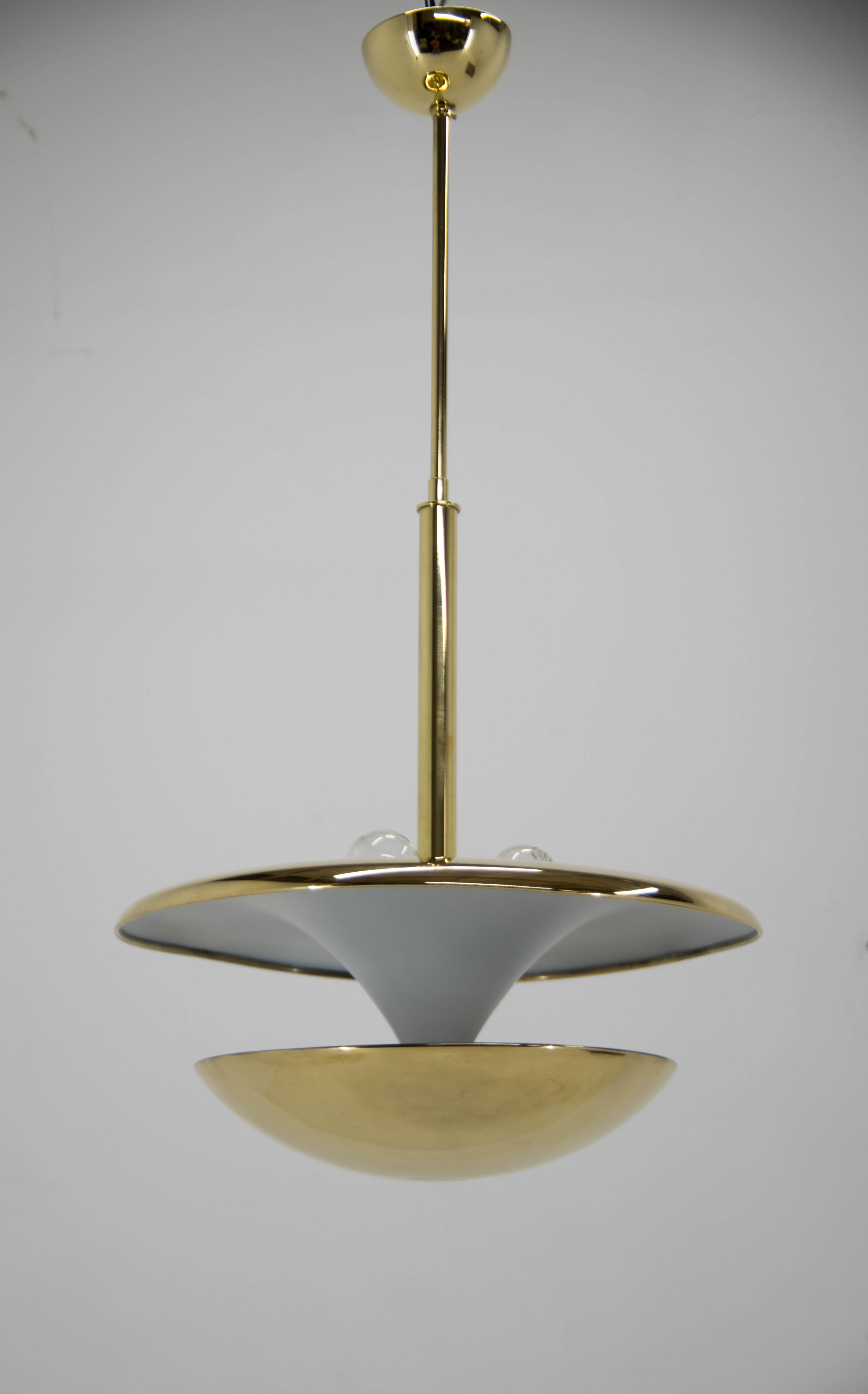 Very rare Bauhaus chandelier executed in polished brass designed by Frantisek Anyz in 1920s and produced by his company IAS. Upper and lower bulbs could be switched separately to produce different kinds of lighting. Very elegant! Very rare! Central