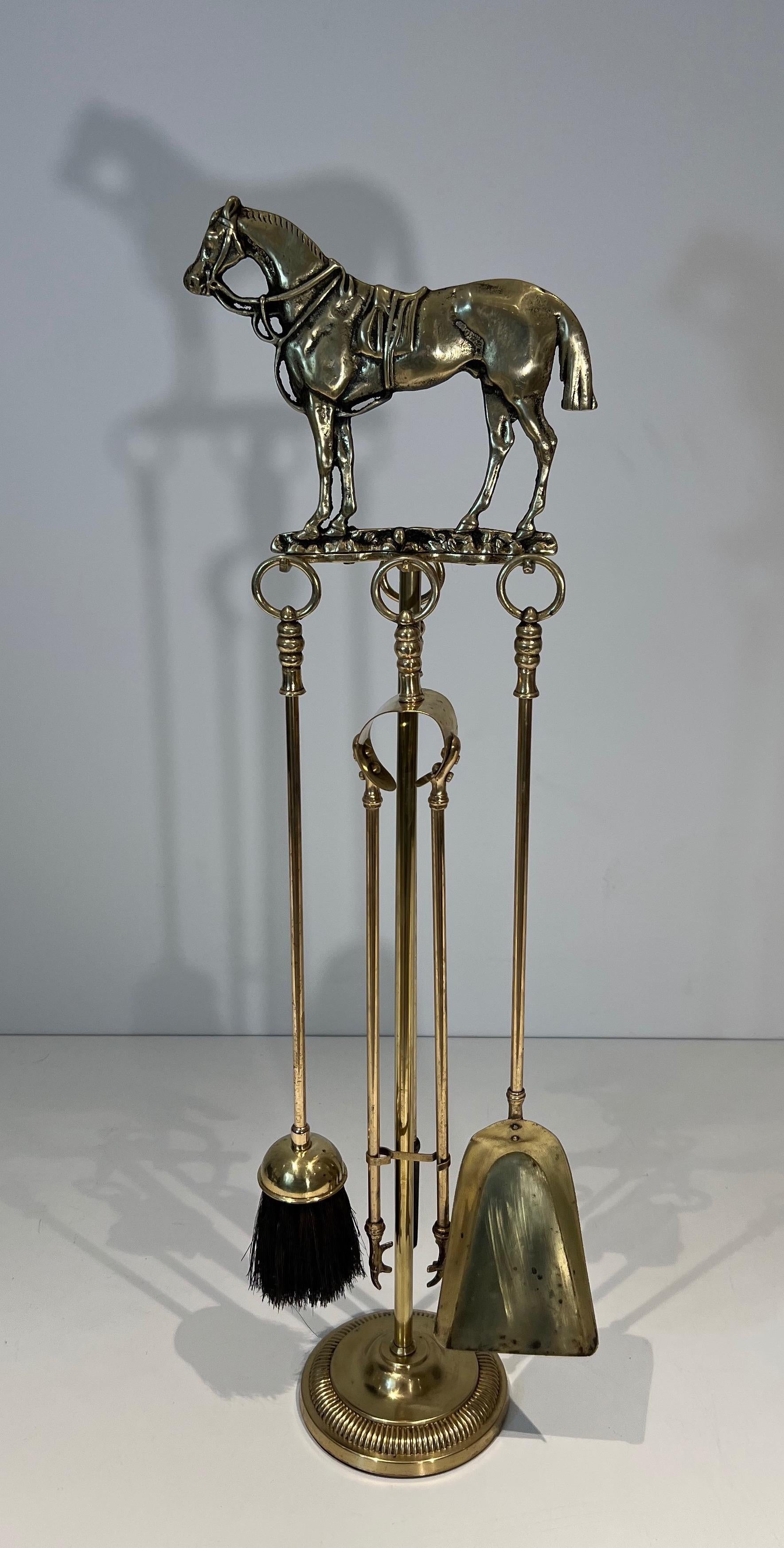 This very rare and beautiful Fireplace Tools on stand is made of brass and bronze. The piece is surmounted by a sculpture representing a Horse. This is a French work. Circa 1920