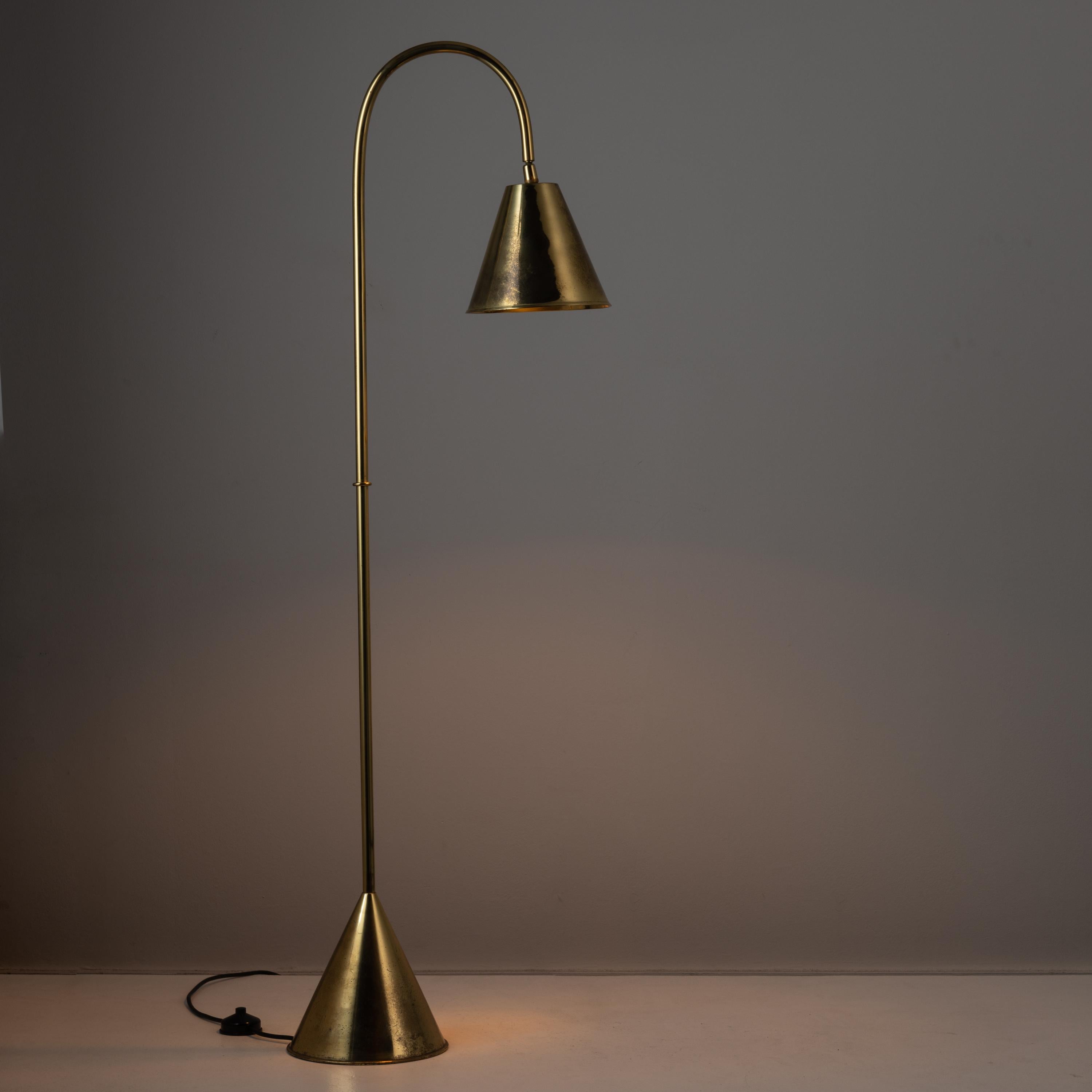 Rare brass floor lamp by Valenti. Designed and manufactured in Spain, circa the 1970s. Purchased as dead stock. Polished brass lamp body and adjustable shade. On and off foot switch attached to cord. Holds one E27 socket type, adapted for the US. We