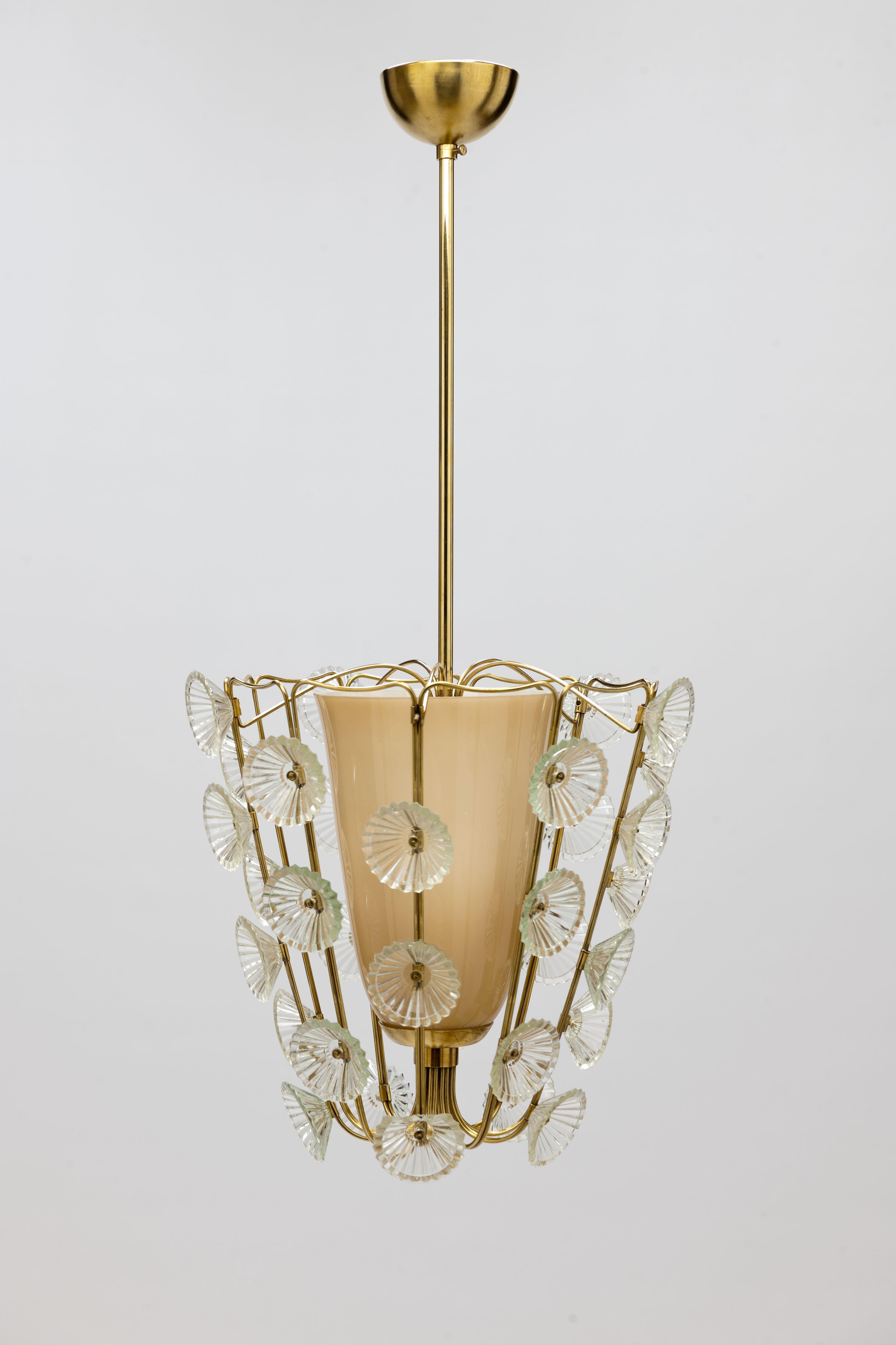 Rare pendant model 1304 by Finnish designer Lisa Johansson-Pape, 1950 for Stockmann Orno, Finland.
Open brass structure with inner diffusor and 35 glass decorative flower decorations.
Brass frame has been professionally cleaned and polished with