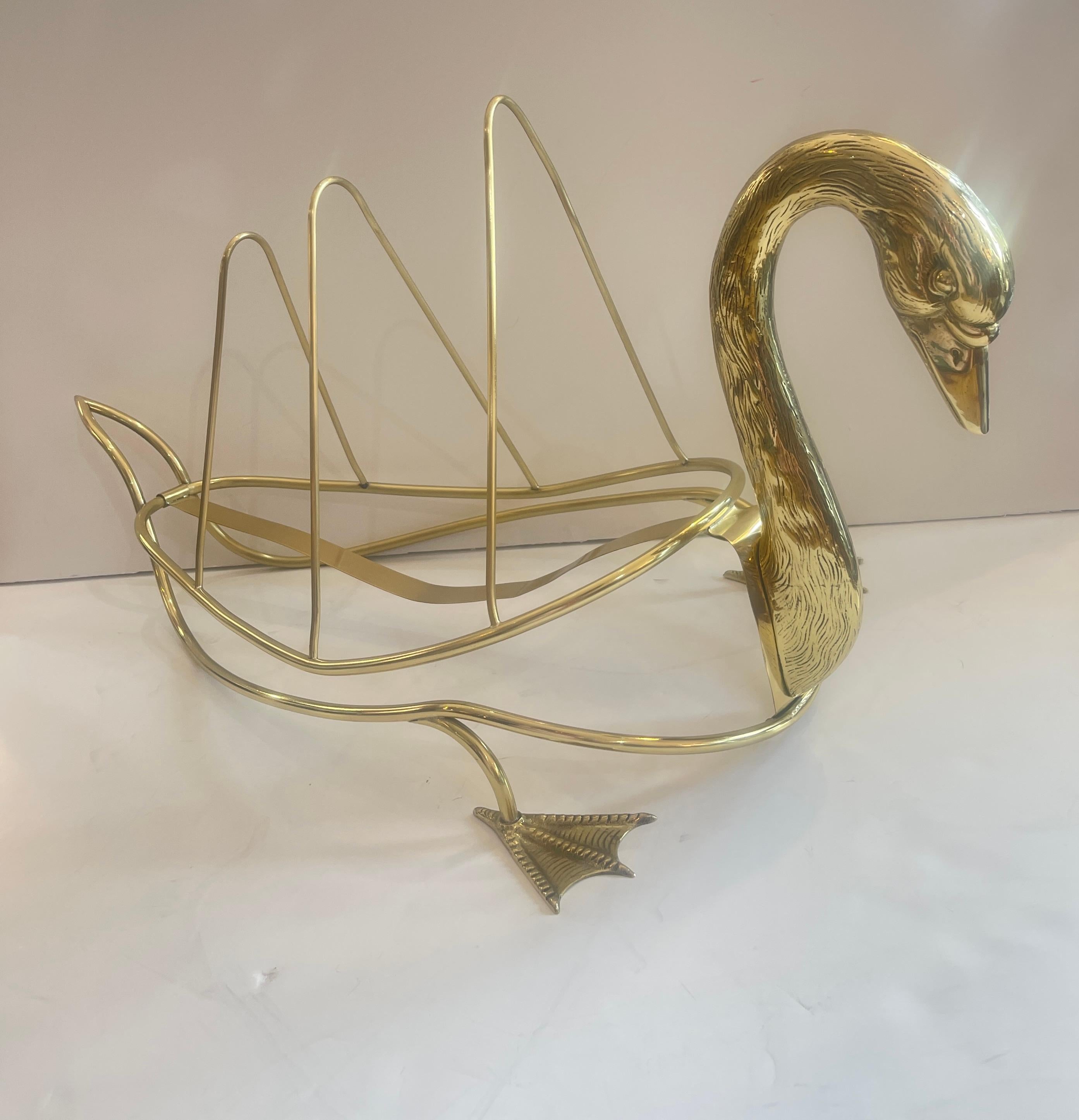 Just in, this Rare Brass Low Swan Magazine Rack Attributed to Maison Jansen, Paris.
The object in the image is a Maison Jansen Style Brass Swan Magazine Holder, a distinctive piece of mid-20th century design. 
Attributed to Maison Jansen, a renowned
