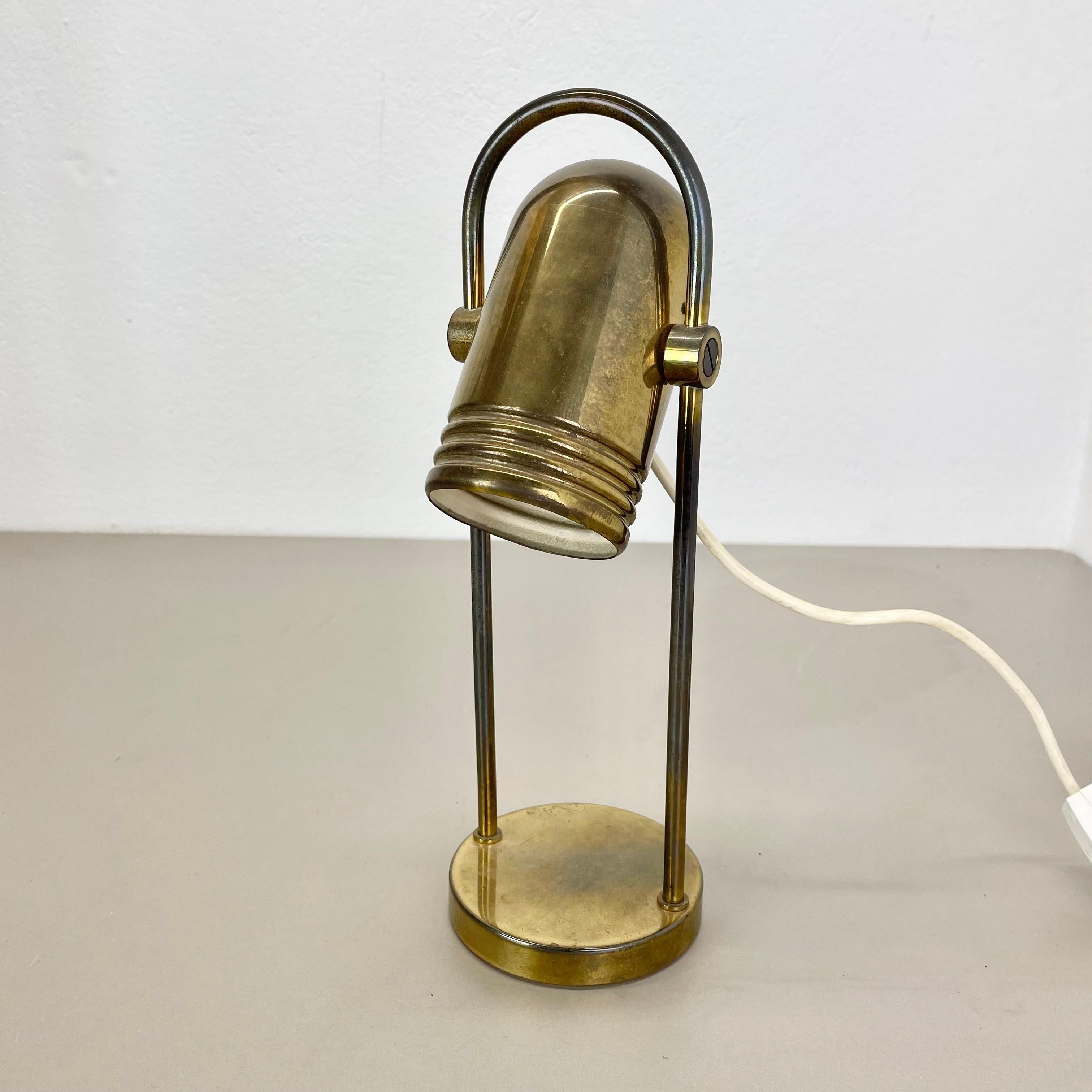 ARTICLE:

table light


AGE:

1970s


DESCRIPTION:

original 70s german modernist table Light made of brass and metal with an adjustable spot shade on the top. this light was designed by Rolf Krüger for Heinz Neuhaus Leuchten, Germany in the 1970s.