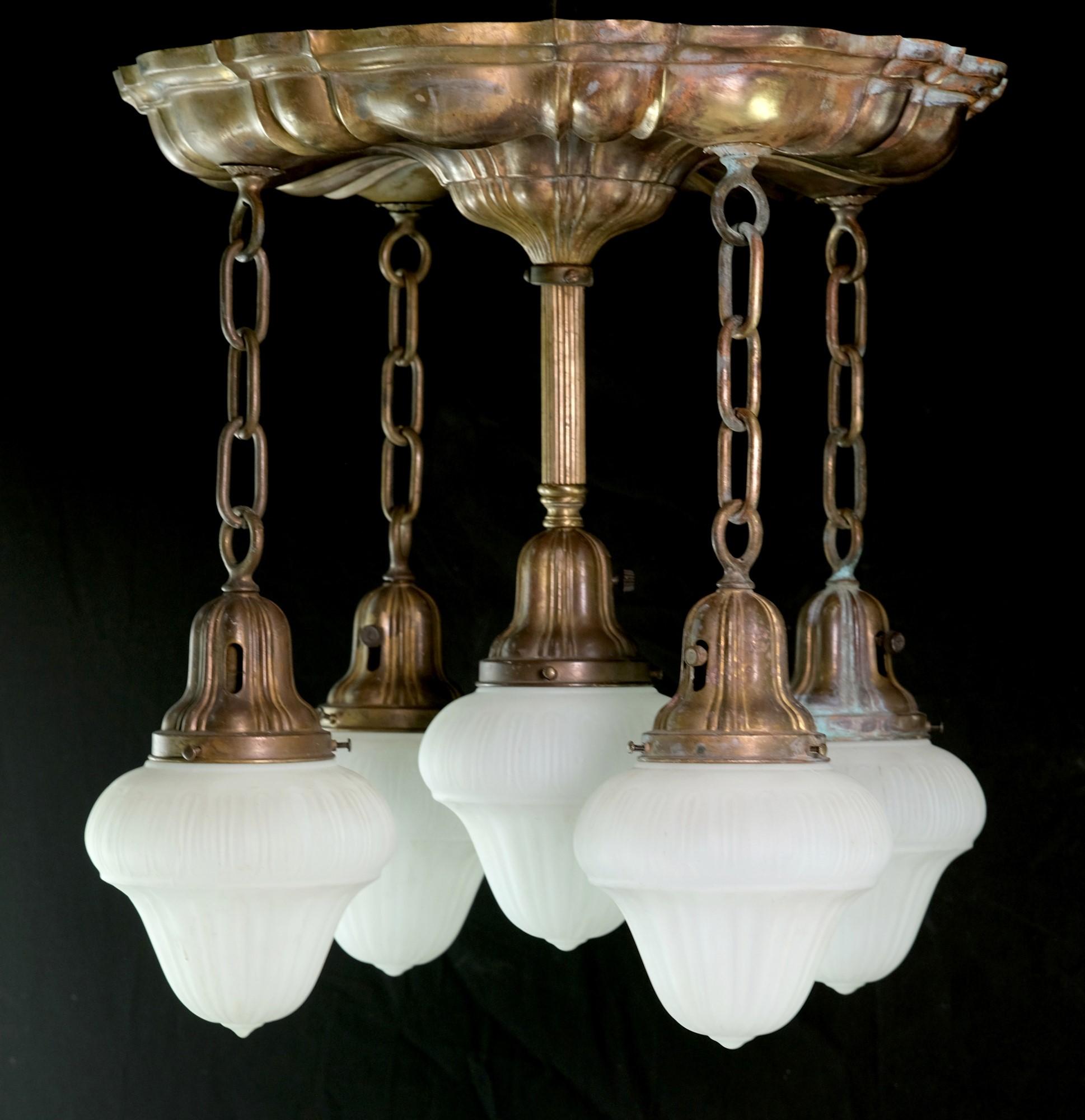 1910s Sheffield brass chandelier featuring five down lights with matching white frosted glass shades. This can be seen at our 400 Gilligan St location in Scranton, PA.