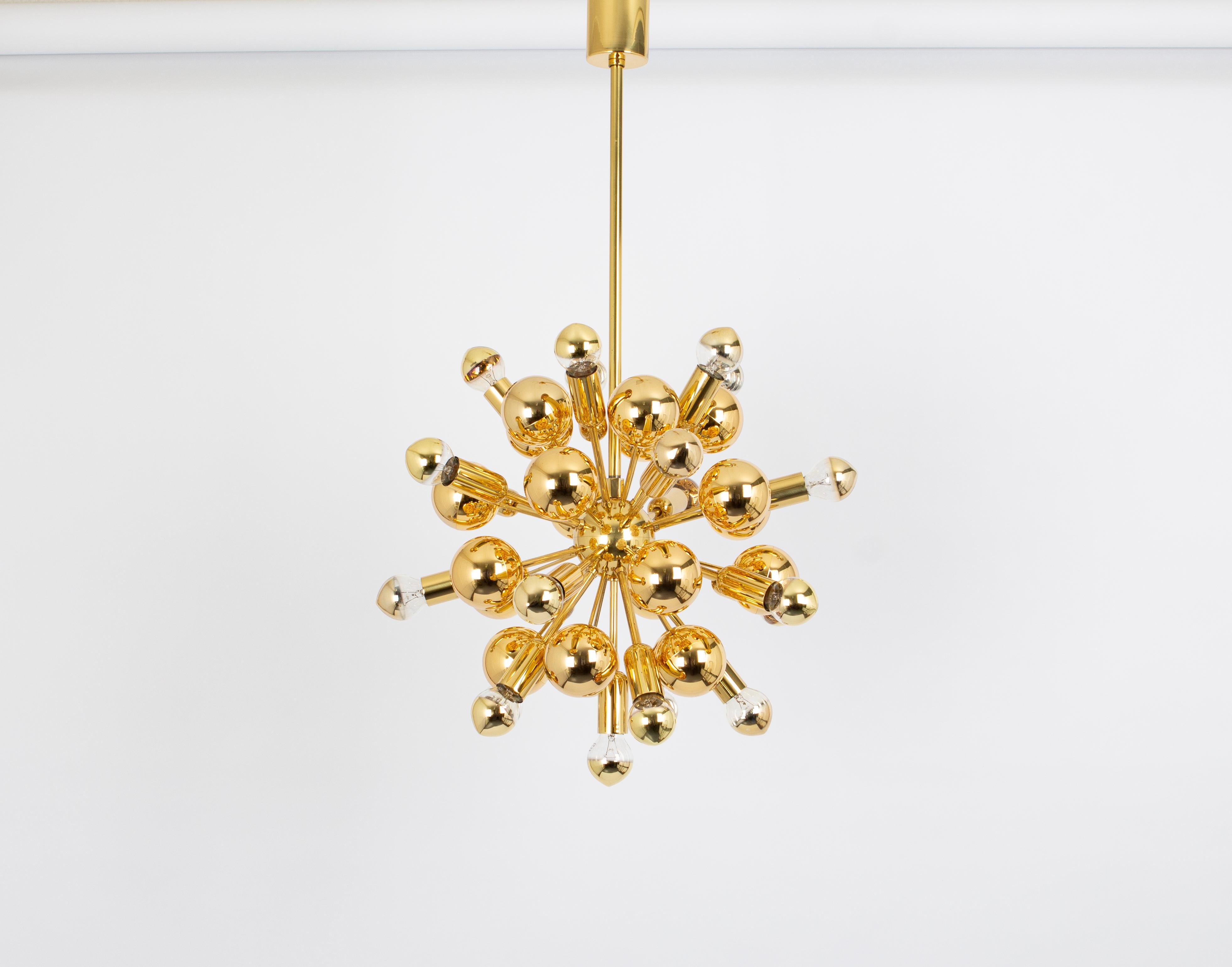 Exclusive and rare brass Sputnik pendant lamp designed by Cosack during the 1970s.

Sockets: It needs 21 x E14 small bulb and function on voltage from 110 till 240 volts.
Dimensions: 
Diameter: 15.9