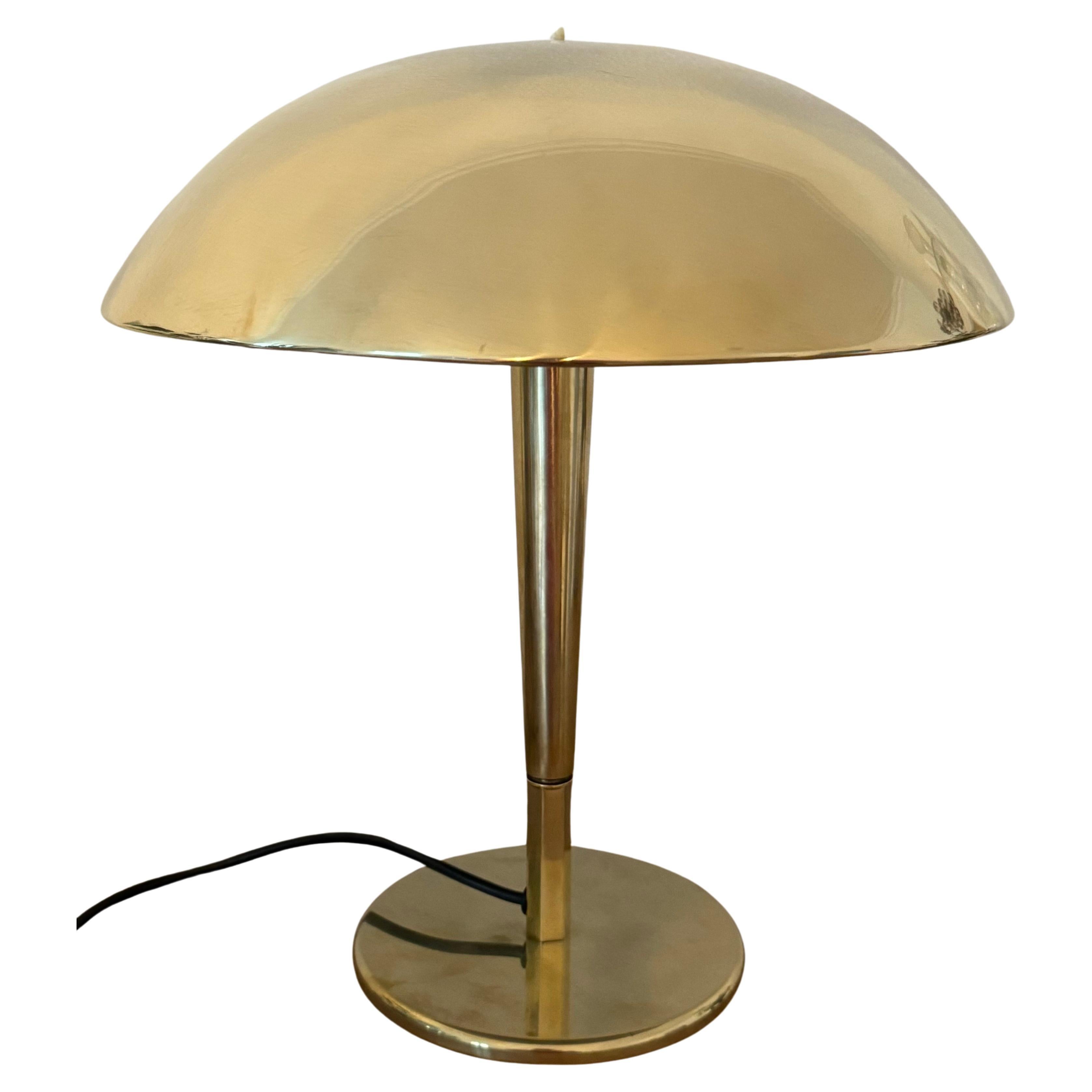 Rare large polished brass table lamp by Paavo Tynell produced by Taito, Finland 1940s. 
In an excellent vintage condition.

Measurements:
Height :    16.14  inches
Diameter:  14.37 inches

Socket: 2 x original Bakelite E27 / E26 for US standards for