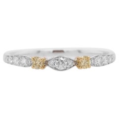 Seltener Ring aus 18 Karat Gold mit gelbem Diamanten im Brillantschliff und weißem Diamanten