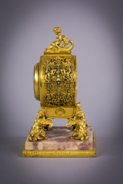 Rare Bronze and Pink-Marble Table Clock, E.F. Caldwell and Co.