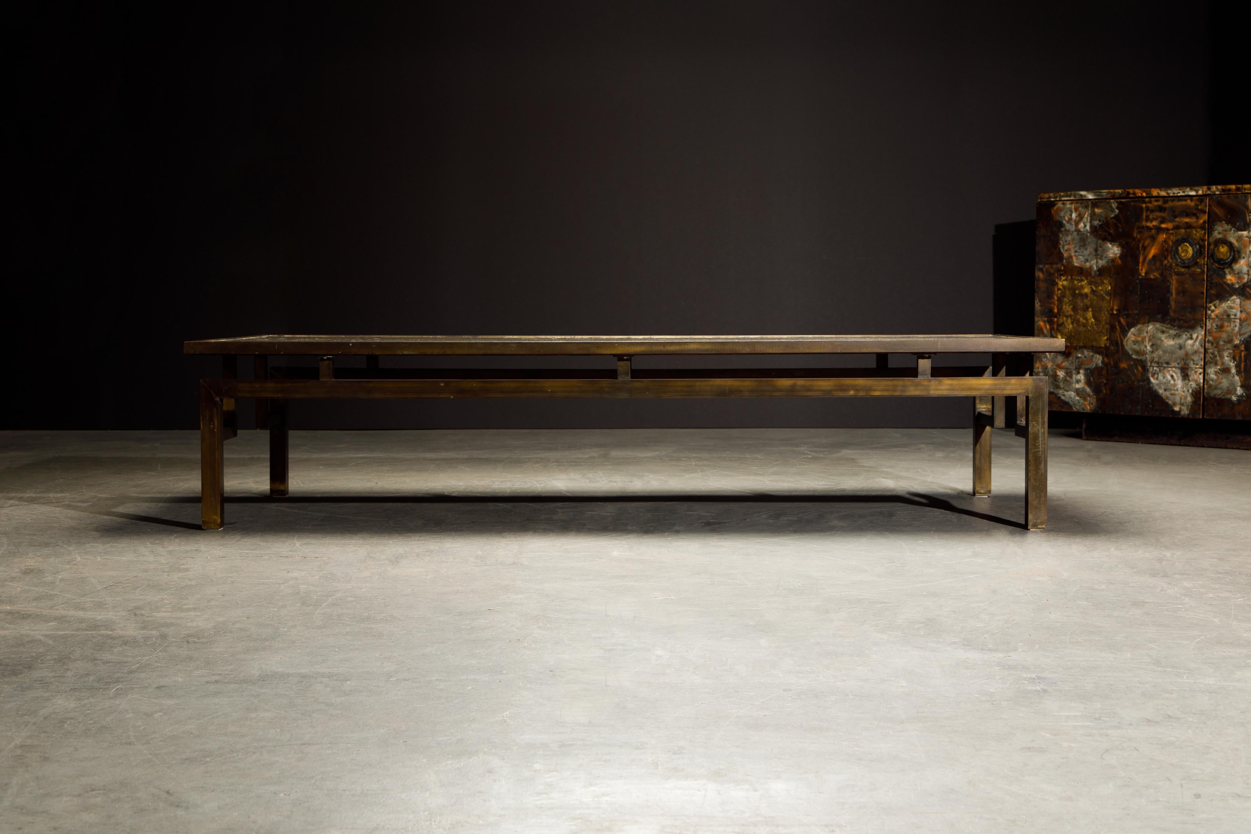 A rare example of the 'Classical' acid etched bronze cocktail table by Philip and Kelvin LaVerne utilizing the base style of the large rectangular 'Chin Ying' design, signed on the table top with the LaVernes signature. 

The large 70