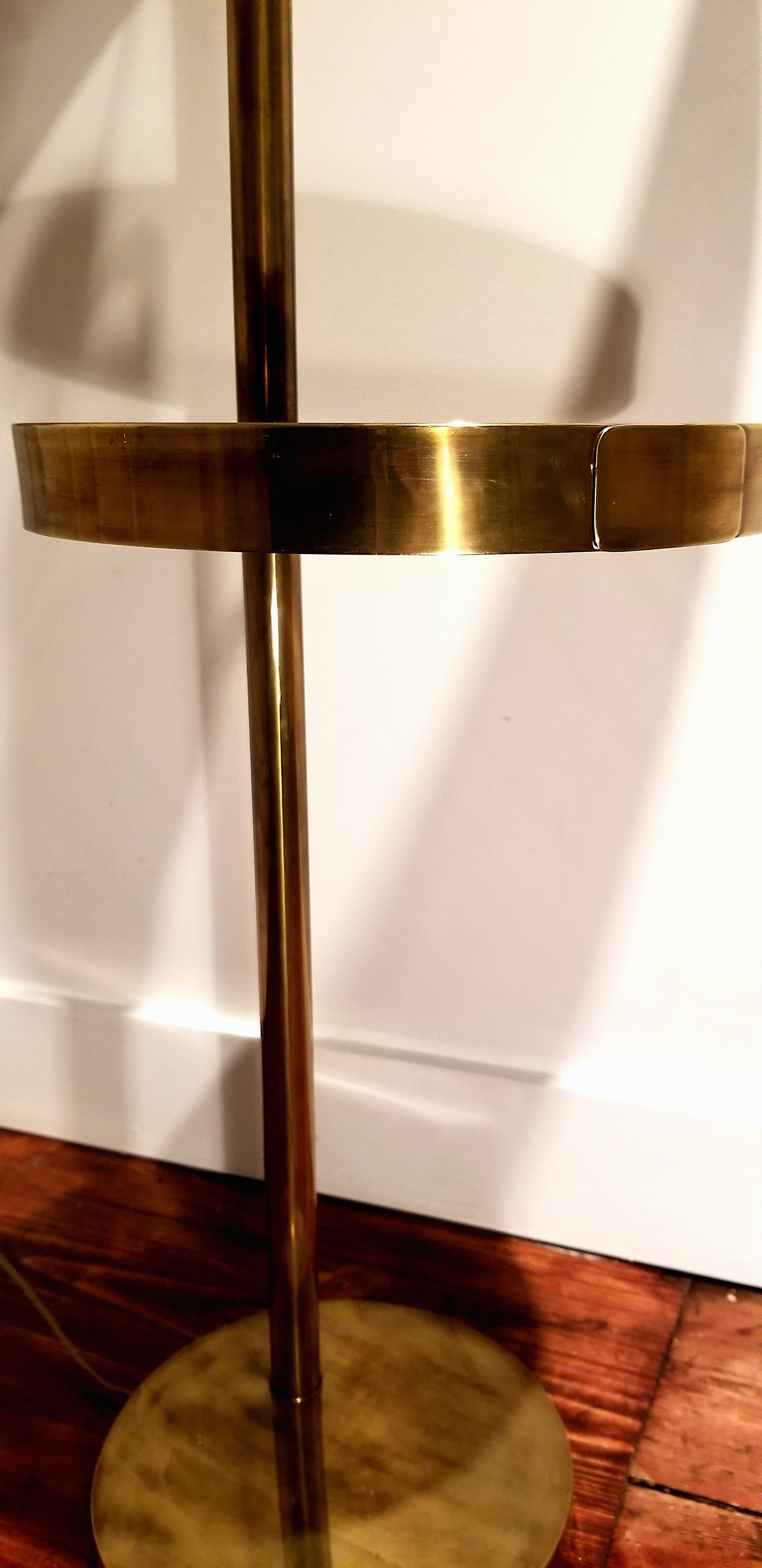 Heavy bronze floor lamp by Hart Associates. Best of quality, heavy solid construction. Dimmer switch with matching bronze knob and finial. Solid bronze construction with black laminate surface for the cocktail table.
Base measures 11in. x