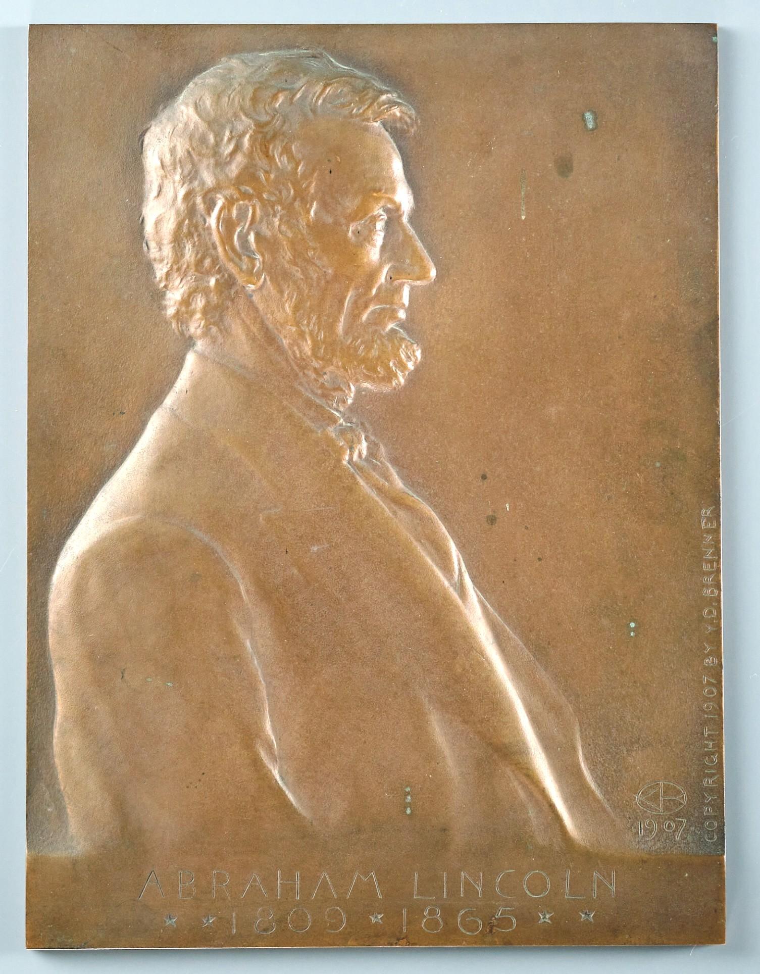 A rare copper-patinated bronze bas-relief portrait plaque of Abraham Lincoln by Lithuanian / American sculptor Victor David Brenner.                                                                                                               