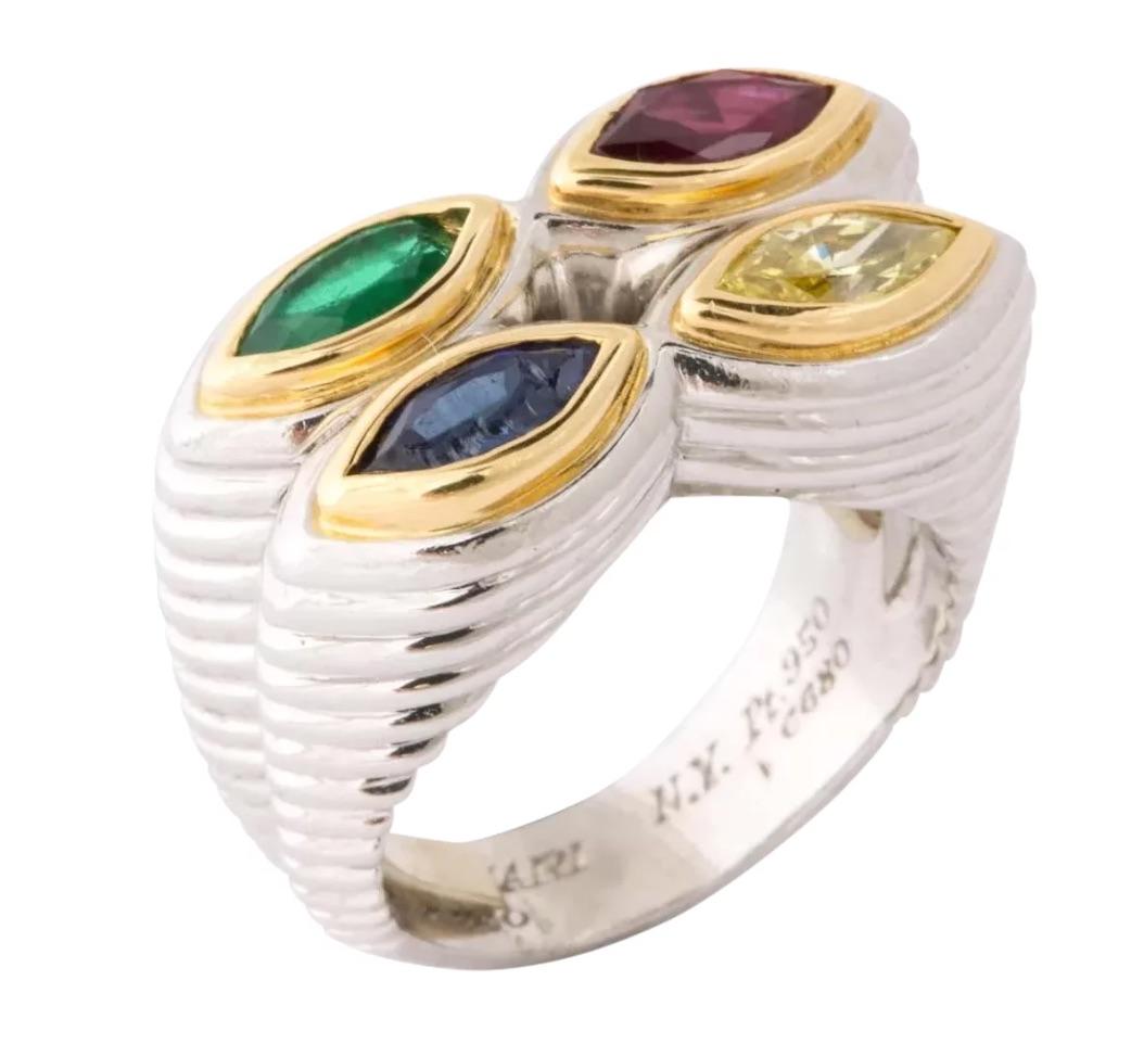 A Rare Bulgari Platinum, Gold, Mulit-Gem and Yellow Diamond Ring.

Fabulous ring by Bvlgari, circa 1970s.

With Sapphires, Ruby, Emerlad, and Yellow Diamond.

Signed and marked (see photos). 100% authentic guaranteed.

Total weight 24 grams.

Due to