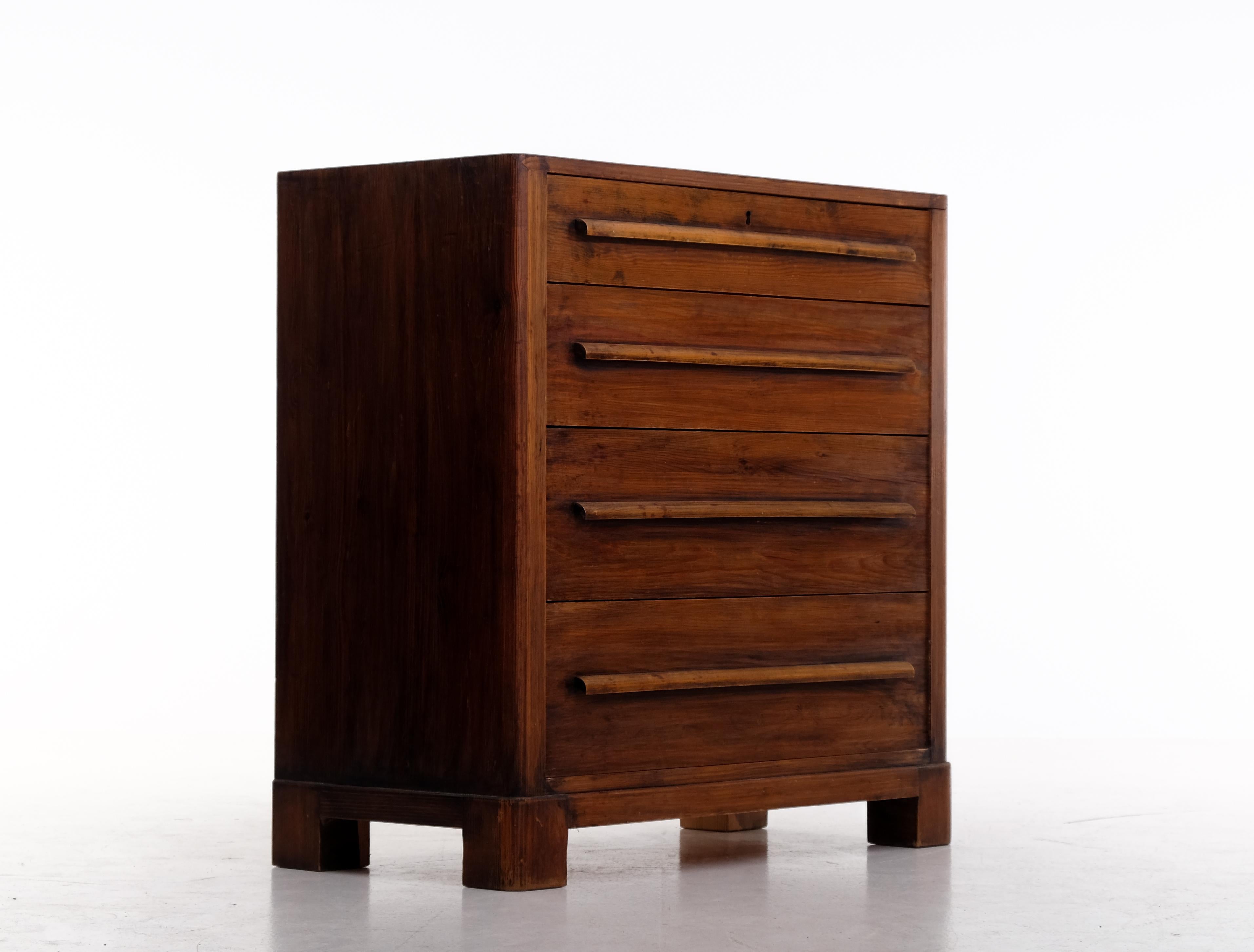 Rare Swedish bureau / chest of drawers in dark stained pine. Produced in Sweden, 1930s.
