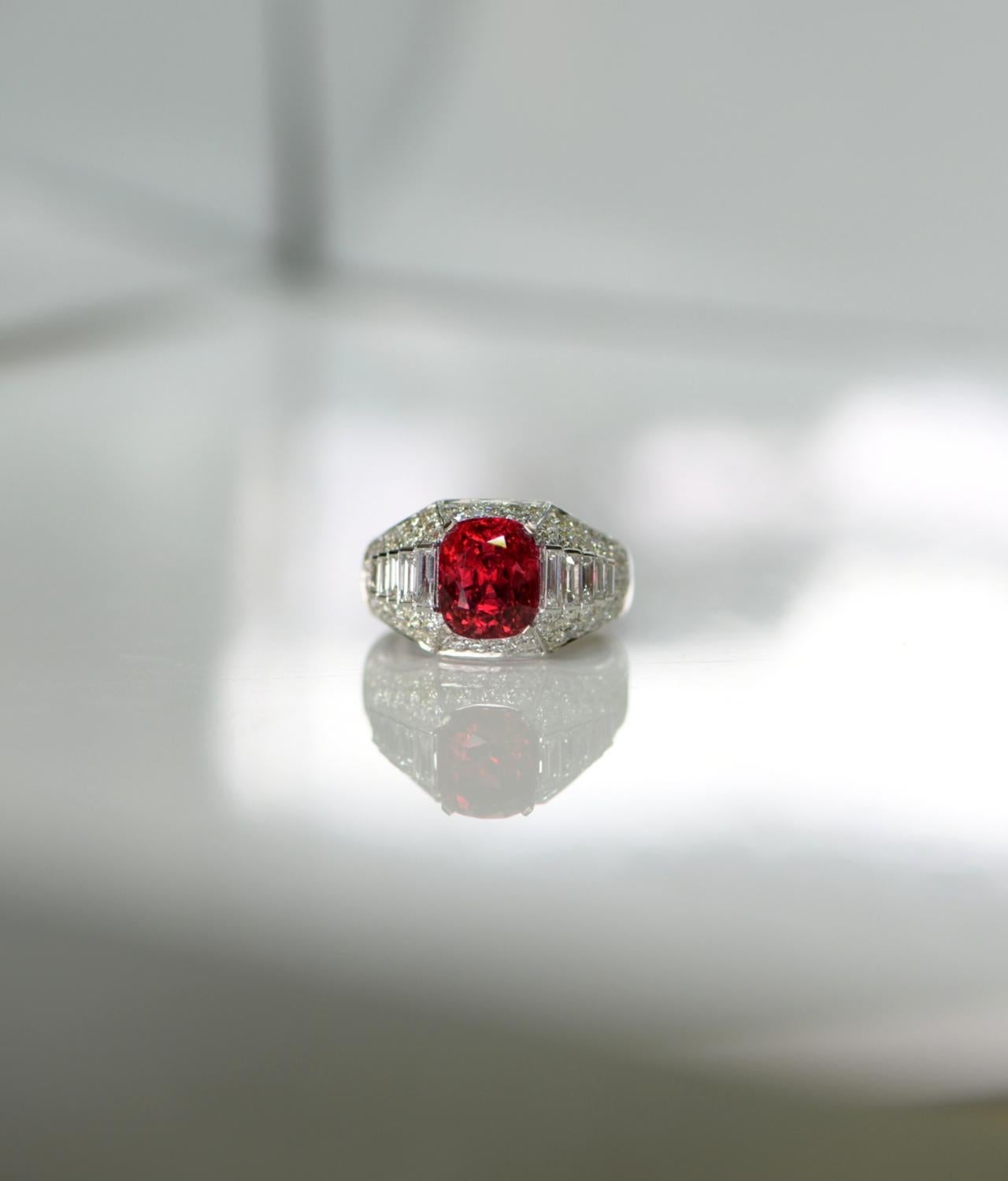 Set with an oval-shaped red spinel weighing over 3.5 carats and accented with baguette and round diamonds, size 6, signed Bulgari.

This spinel has an absolutely gorgeous colour and the cut is excellent. The fire you get from this stone is simply