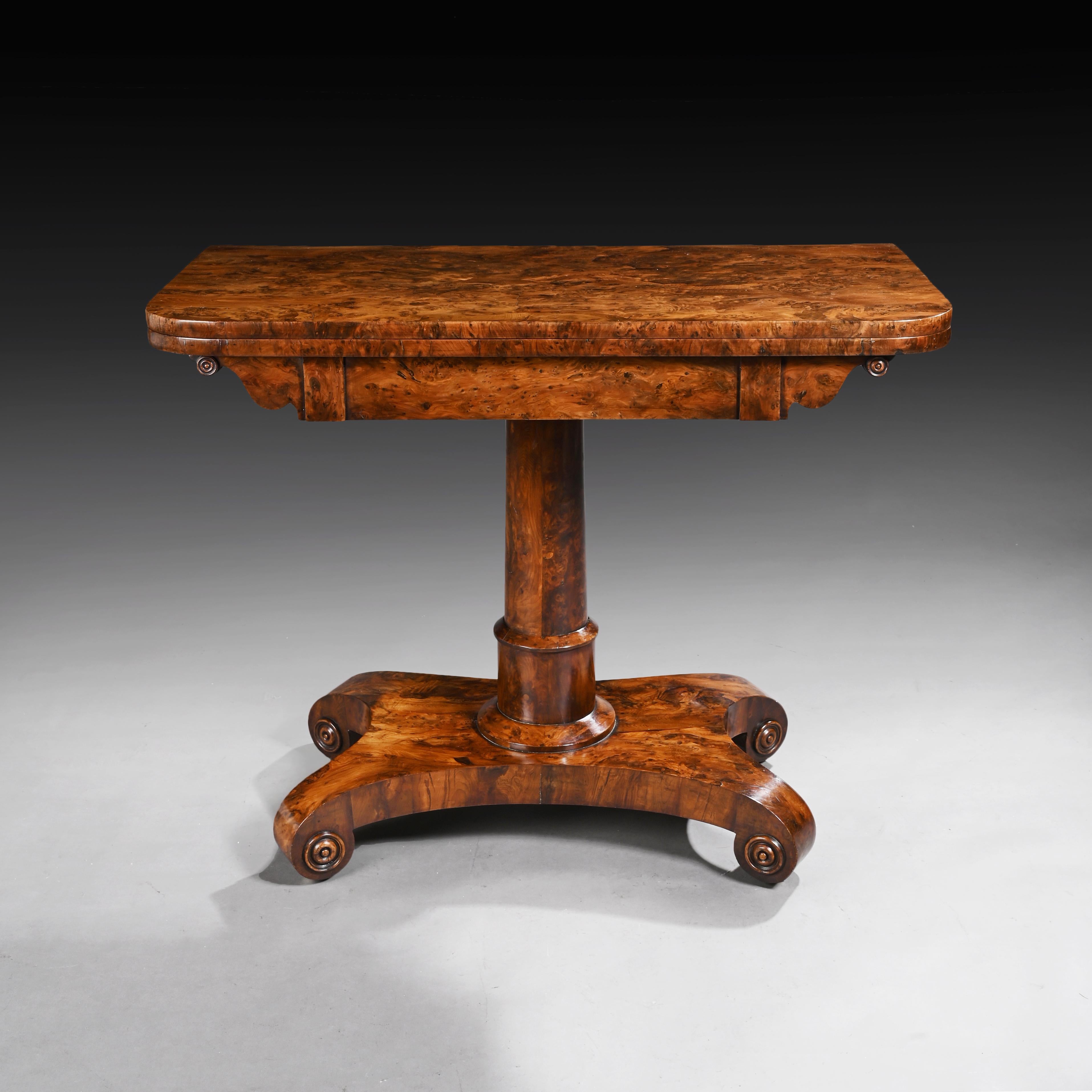 A superb quality and rare burr yew wood late Regency / William IV card table.

English, circa 1830.

The finely figured and burr yew wood rectangular fold over top with rounded corners opens to reveal the original baize inset over a frieze with