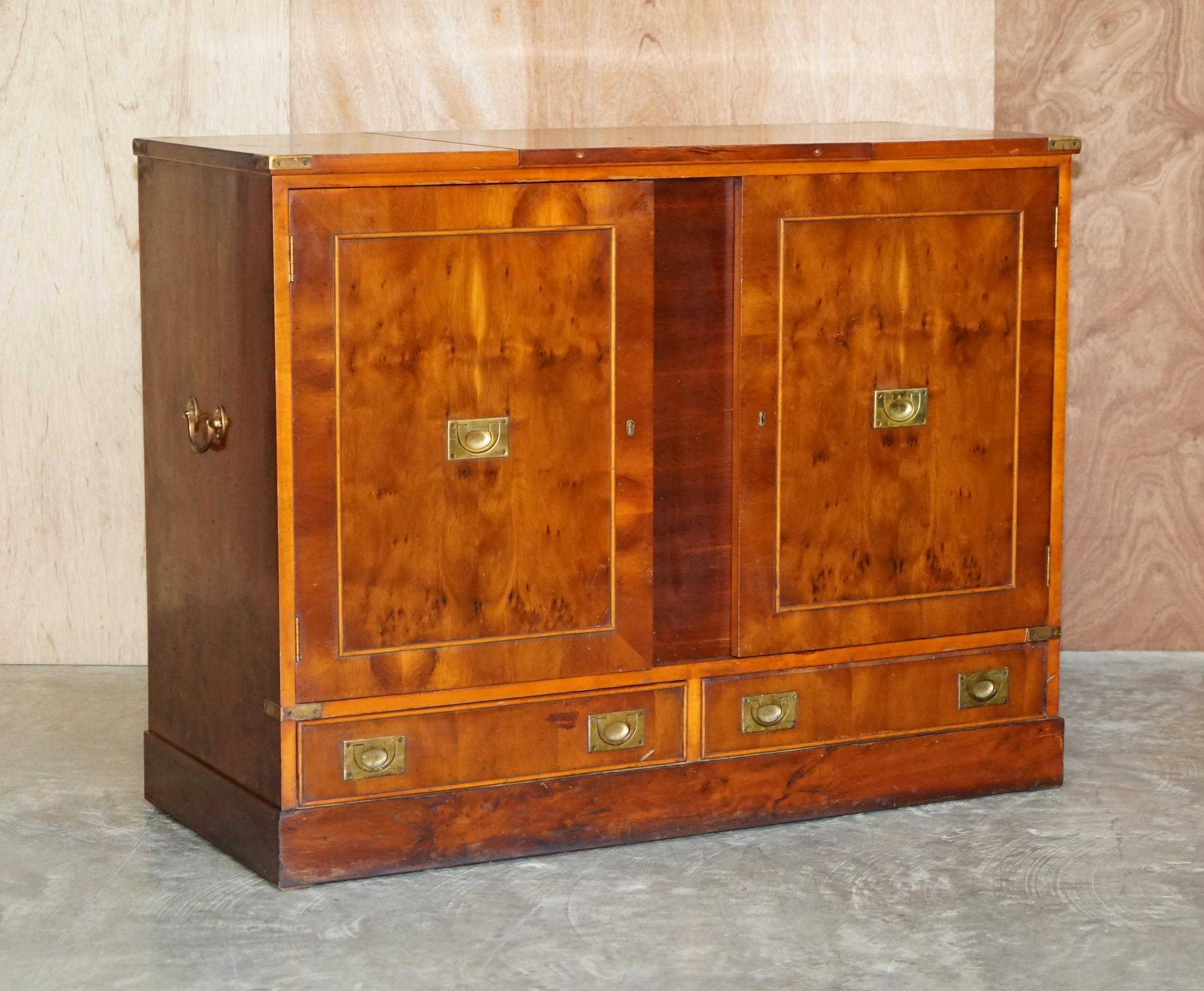 We are delighted to offer this rare vintage burr yew wood military campaign gentleman’s compendium

This piece is based on a Victorian Military Campaign Gentleman’s dressing table. You would have drawers for folded linens, a cupboard section for a
