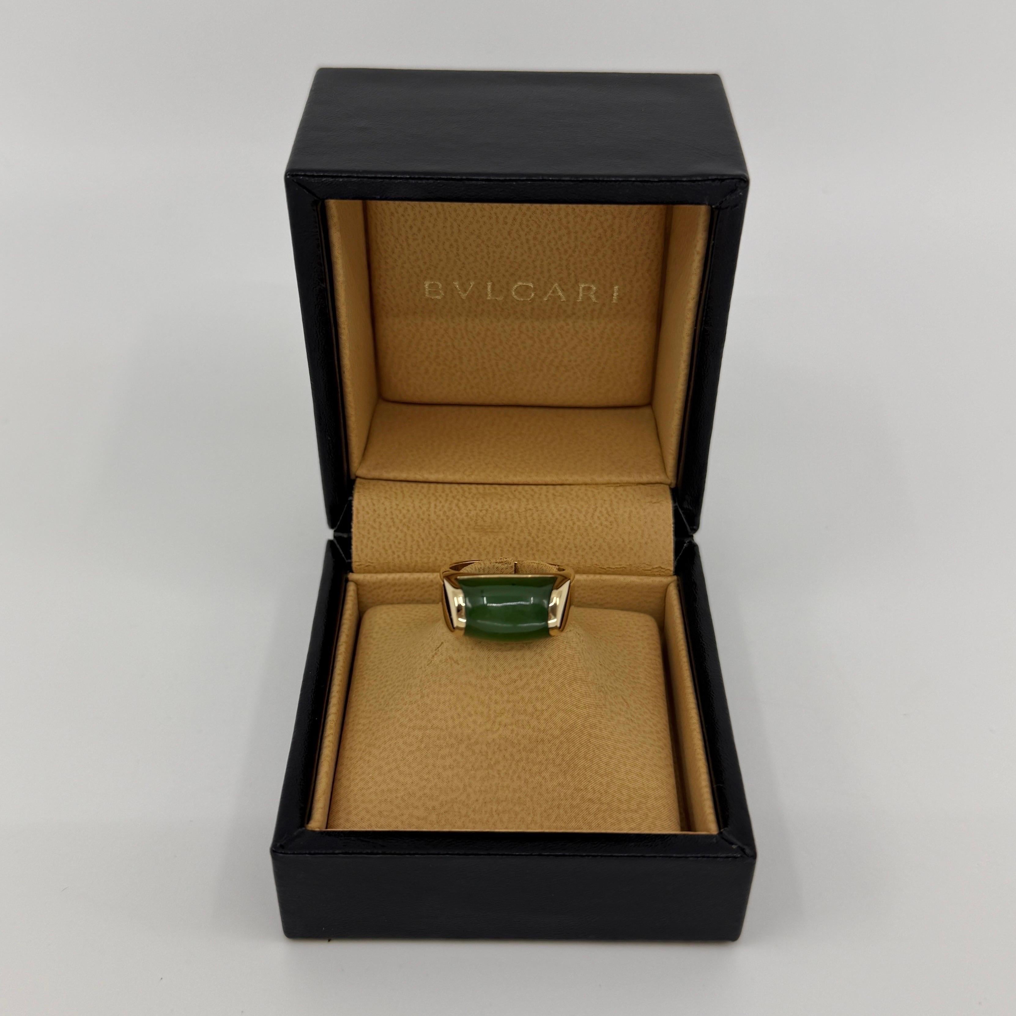 Rare Bvlgari Green Jade Tronchetto 18k Yellow Gold Ring.

Beautiful domed green nephrite jade set in a fine 18k yellow gold tension set ring. A very rare piece by Bvlgari, featuring a top grade, bright green jade gemstone.

The ring is in excellent