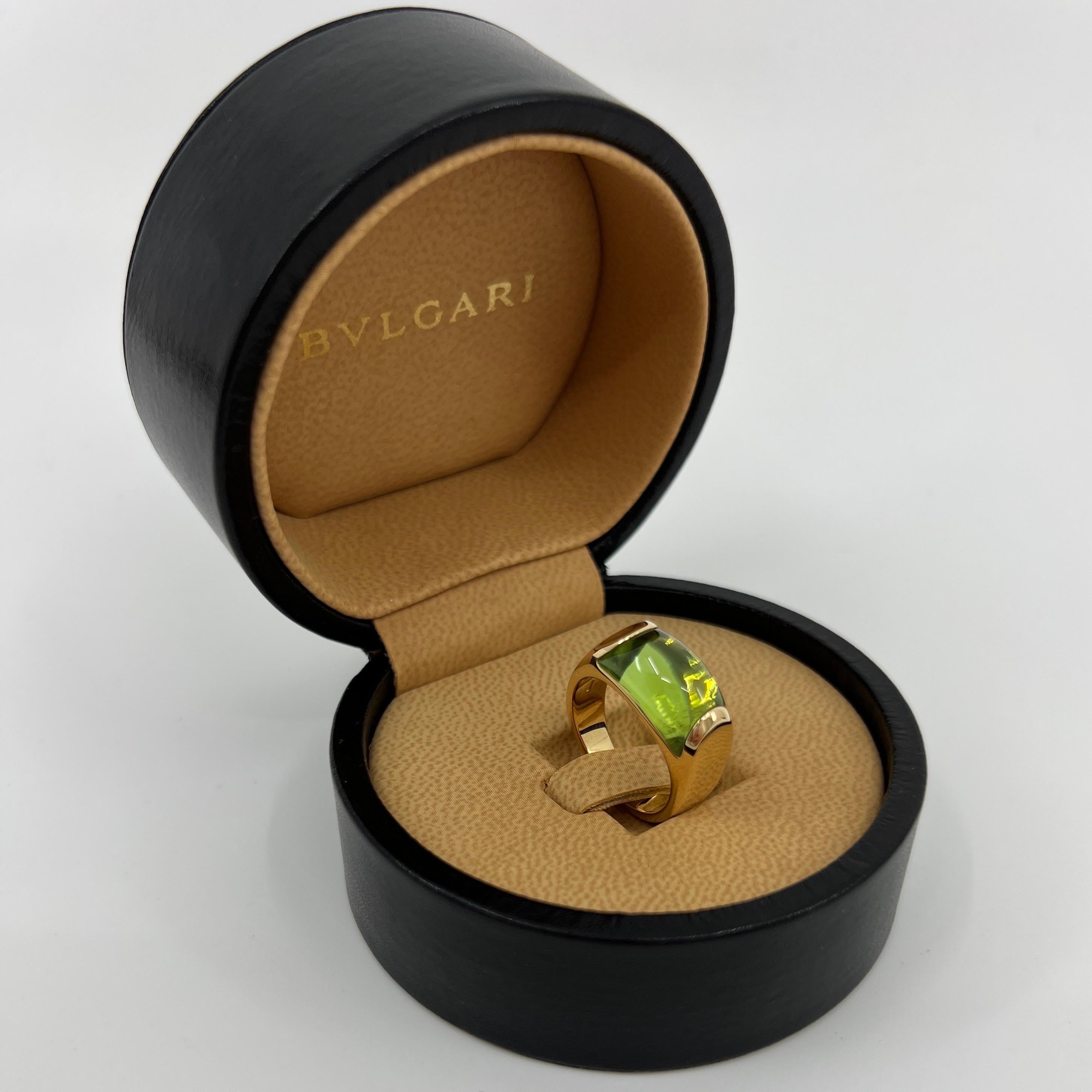 Rare Bvlgari Green Peridot Tronchetto 18k Yellow Gold Ring.

Beautiful domed green peridot set in a fine 18k yellow gold tension set ring.

In very condition, has been professionally polished and cleaned. Very small crack along one of the bottom
