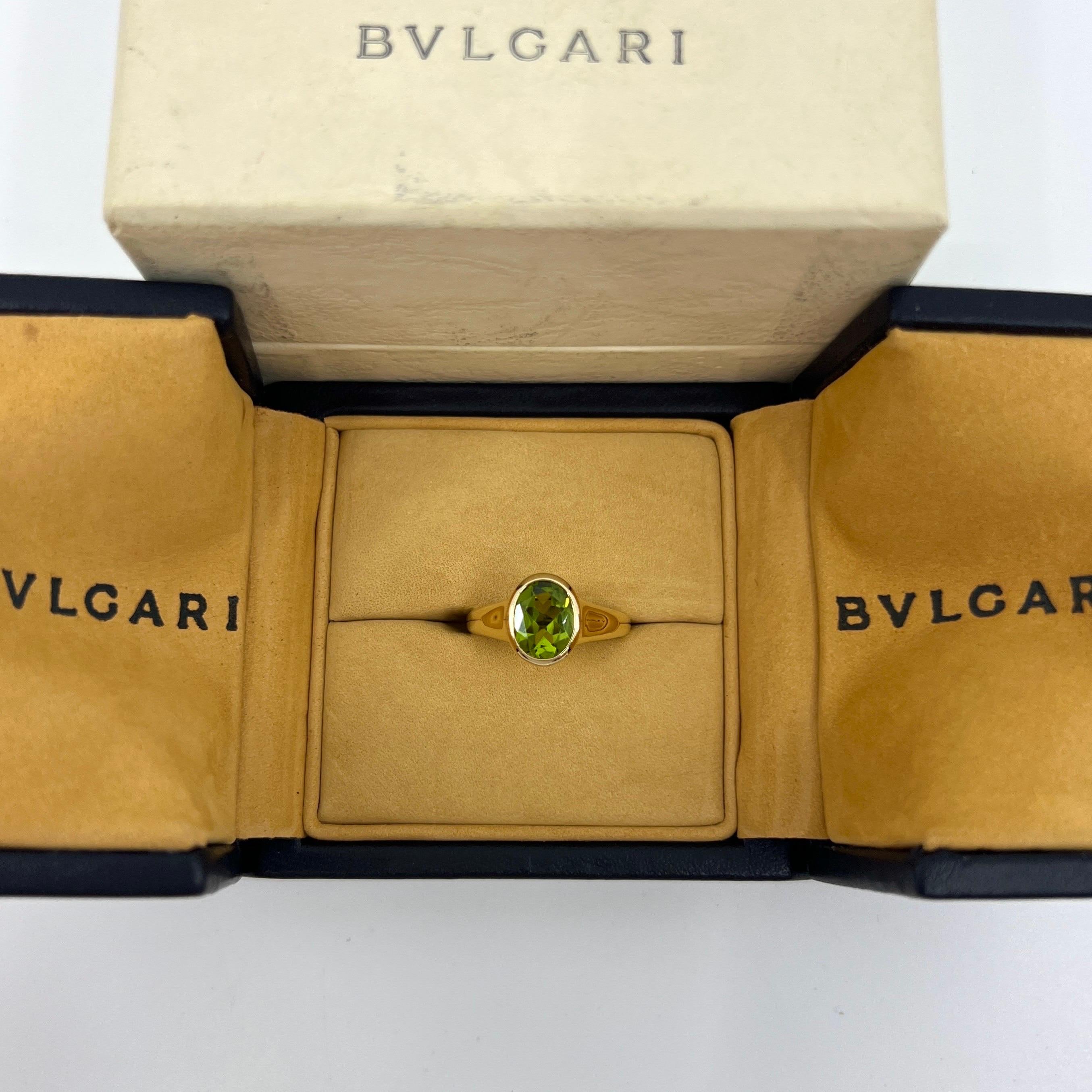Oval Cut Rare Bvlgari Green Peridot Oval 18k Yellow Gold Signet Style Bezel Rubover Ring For Sale