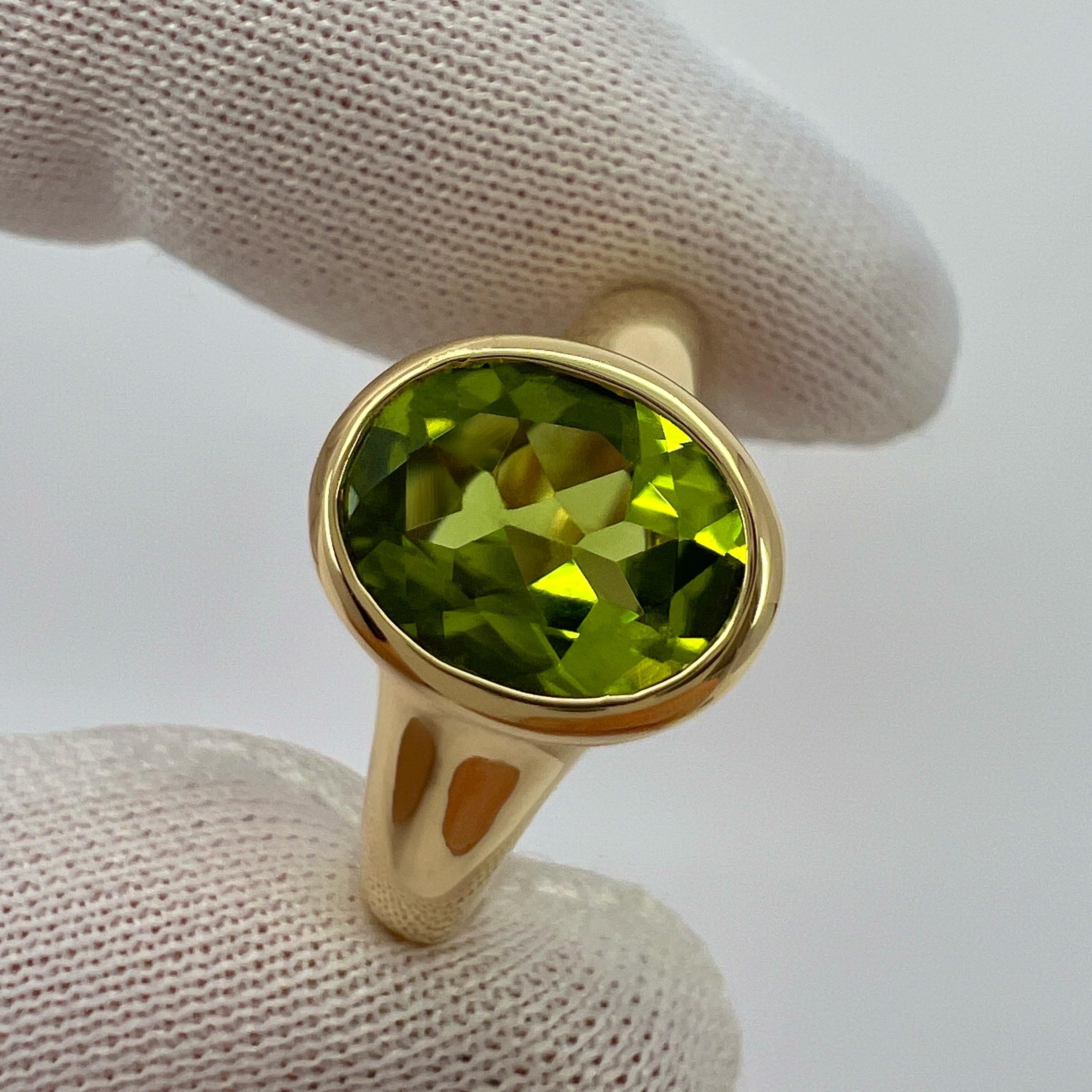 Women's or Men's Rare Bvlgari Green Peridot Oval 18k Yellow Gold Signet Style Bezel Rubover Ring For Sale
