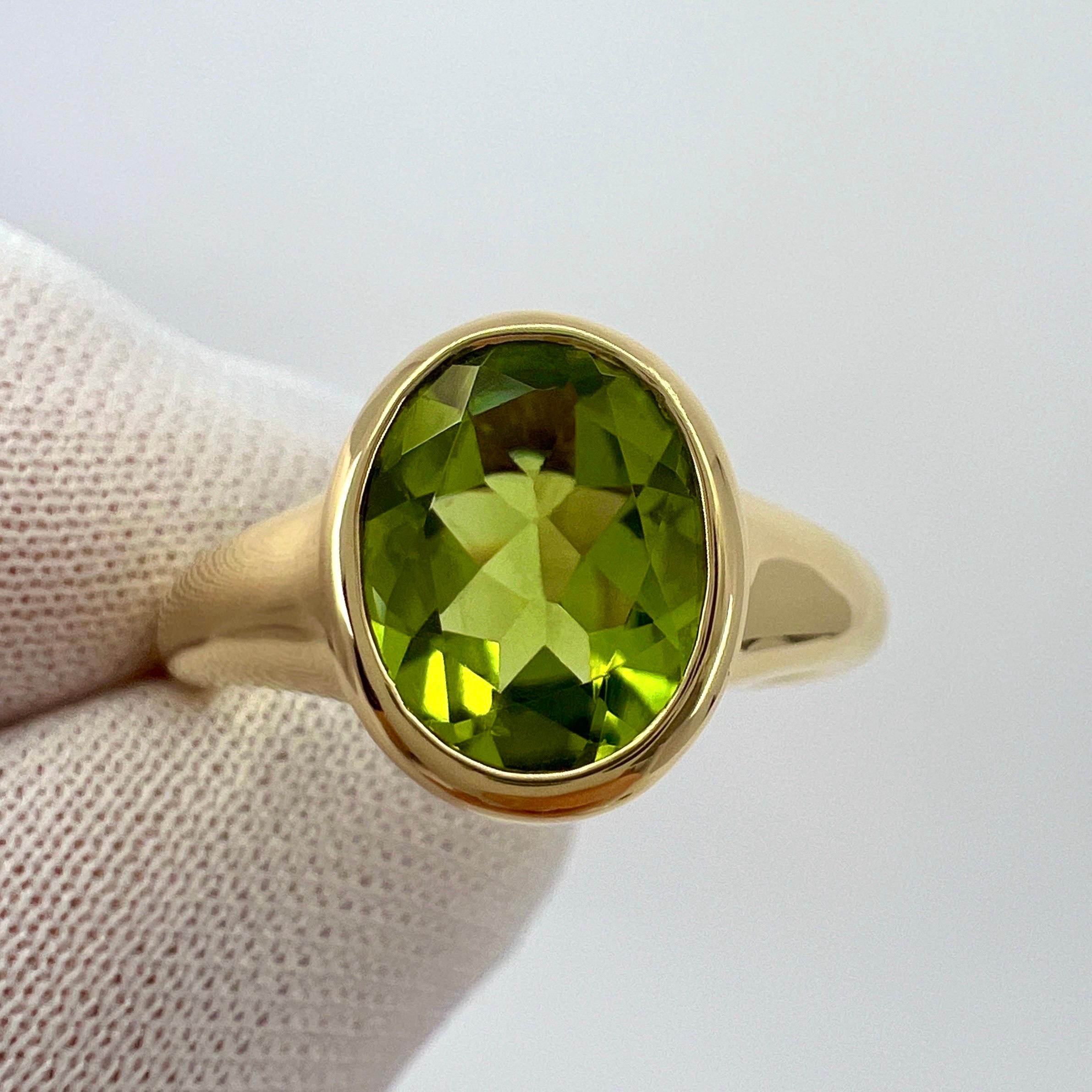 Rare Bvlgari Green Peridot Oval 18k Yellow Gold Signet Style Bezel Rubover Ring For Sale 1