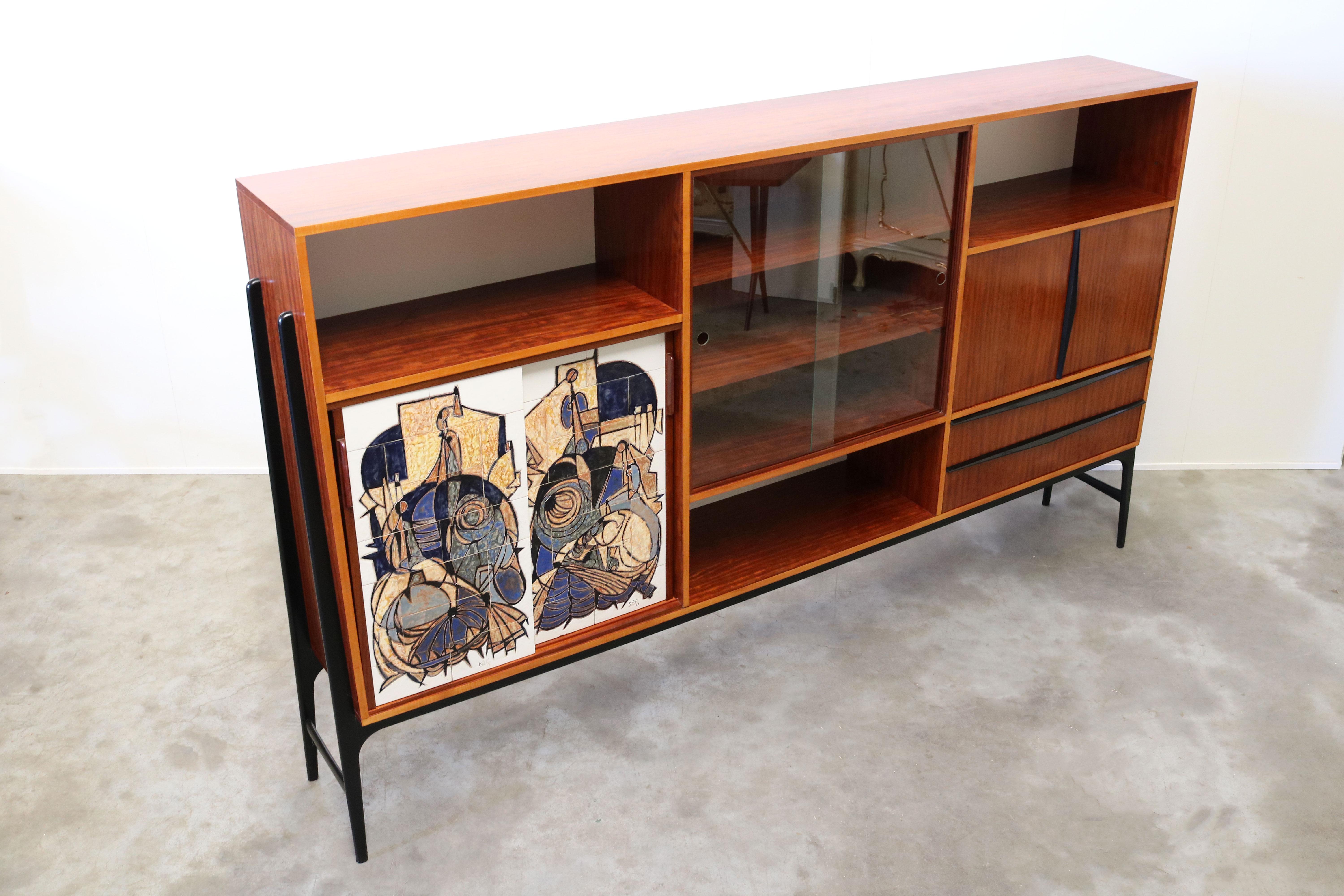 A magnificent piece of design history, this vintage cabinet / highboard is designed by the famous Belgium designer: Alfred Hendrickx for Belform. However this is a special one of a kind edition for the ''1958 World Expo in Bruxelles''. For the world