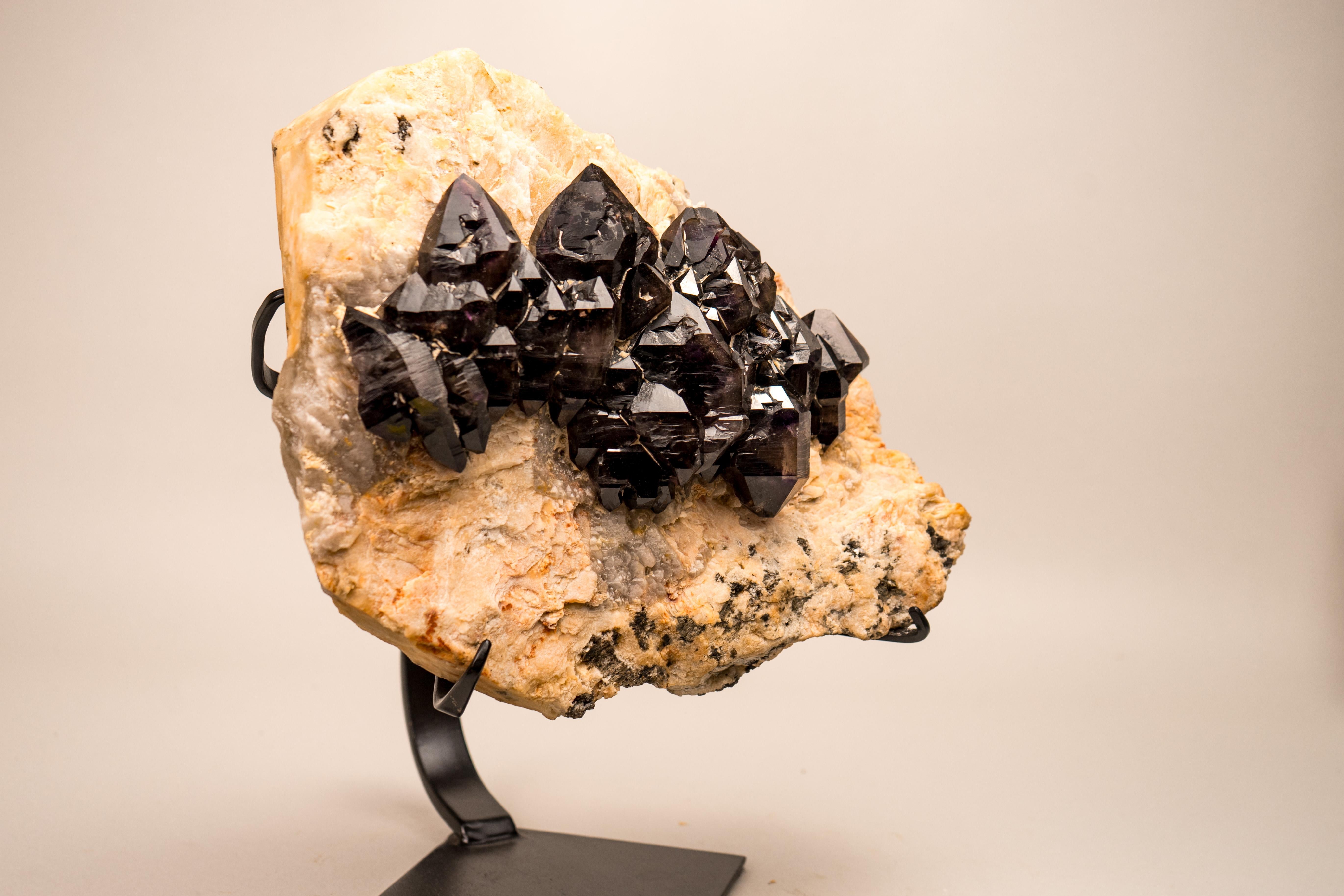 Large Elestial Amethyst Crystal Specimen with Brazil’s Legendary Cacoxenite

▫️ Description

The largest of the find, this rare mineral is a true masterpiece: a Matrix Cacoxenite Amethyst specimen is gracefully set on a natural feldspar and quartz