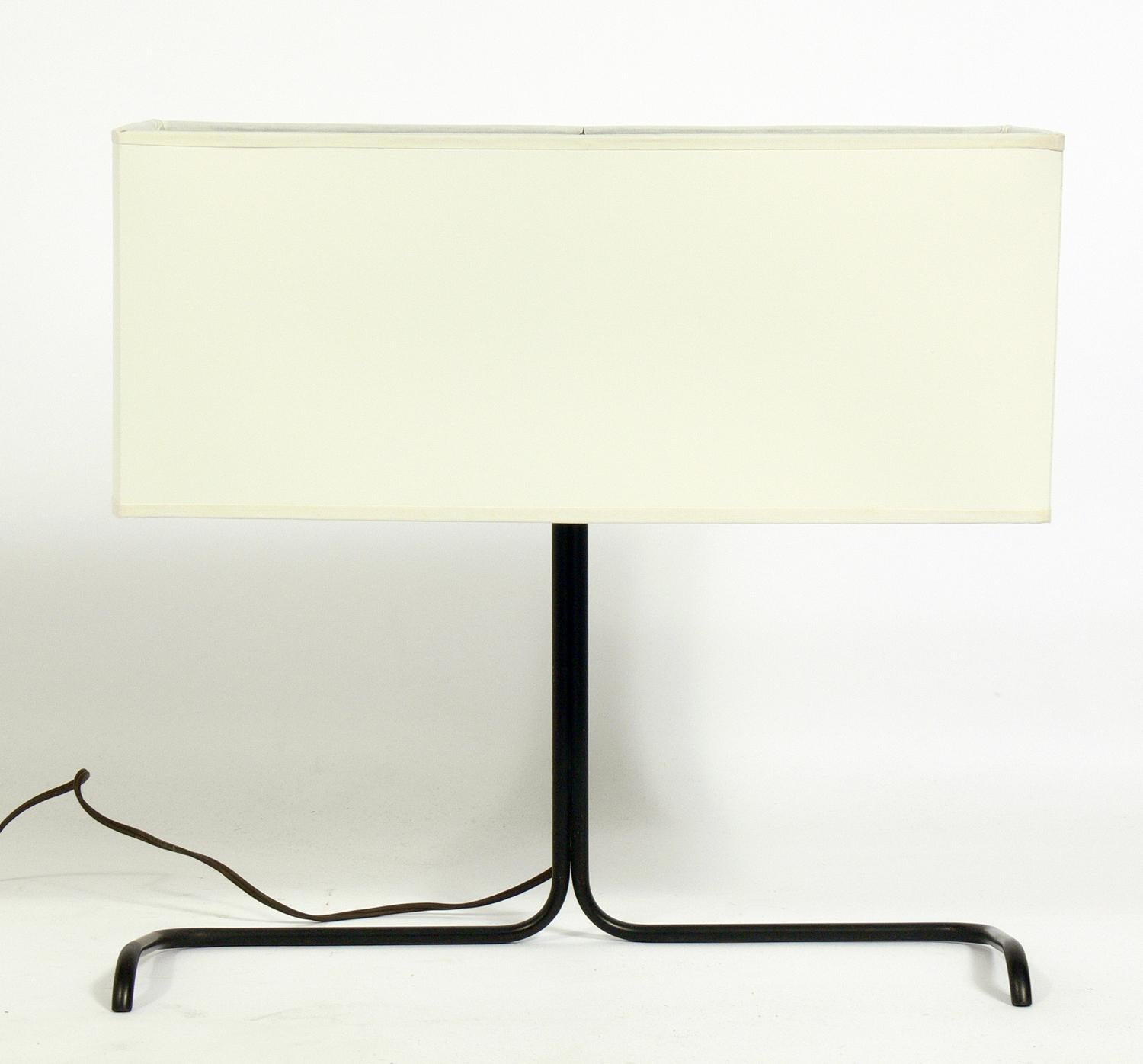 Rare cantilevered desk lamp by Gerald Thurston for Lightolier, American, circa 1950s. Paper lamp shade has been accurately replaced using the original shade frame.