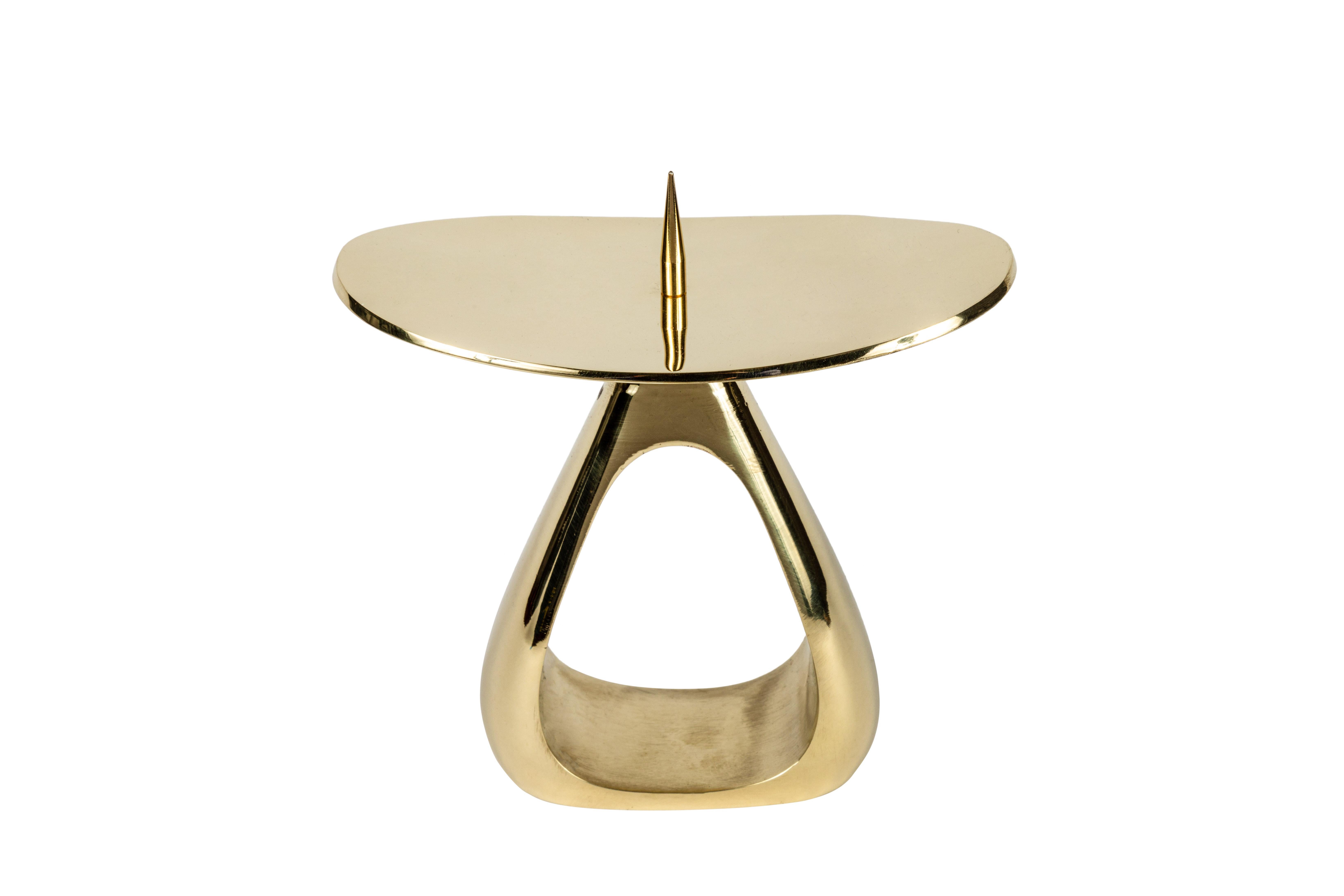 Rare Carl Auböck #3600 polished brass candleholder. Designed in the 1940s, this incredibly clean and refined Viennese candleholder is executed in polished brass by Werkstätte Carl Auböck, Austria. 

Price is per item. Two in stock ready to ship.