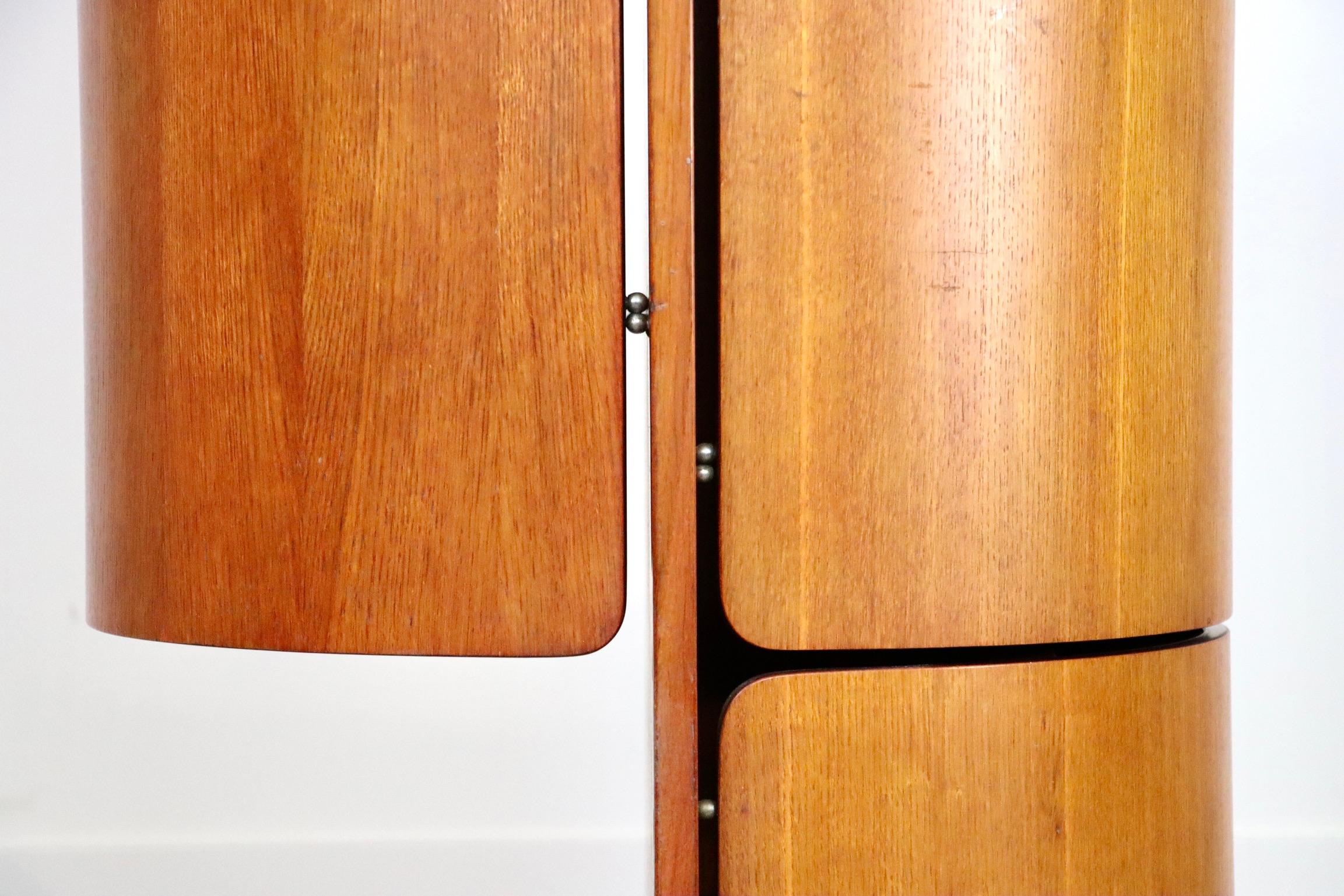 Fantastic and rare Carlo De Carli Vanity Wardrobe in walnut with a swivel base for Fiarm, 1960s. This stunning piece folds open to a coat hanger with the coat hangers, which are the iconic design of renowned designer Carlo de Carli, and has a bottom