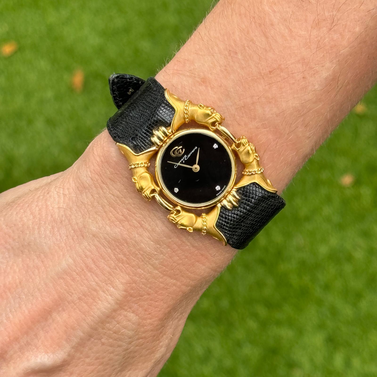 Rare Carrera Y Carrera Panther Head watch crafted in 18 karat yellow gold.The panter's make up the bezel of the watch which has a black diamond dial and original black strap. Quartz movement, numbered. The case measures 30mm in width, 8 inch strap.