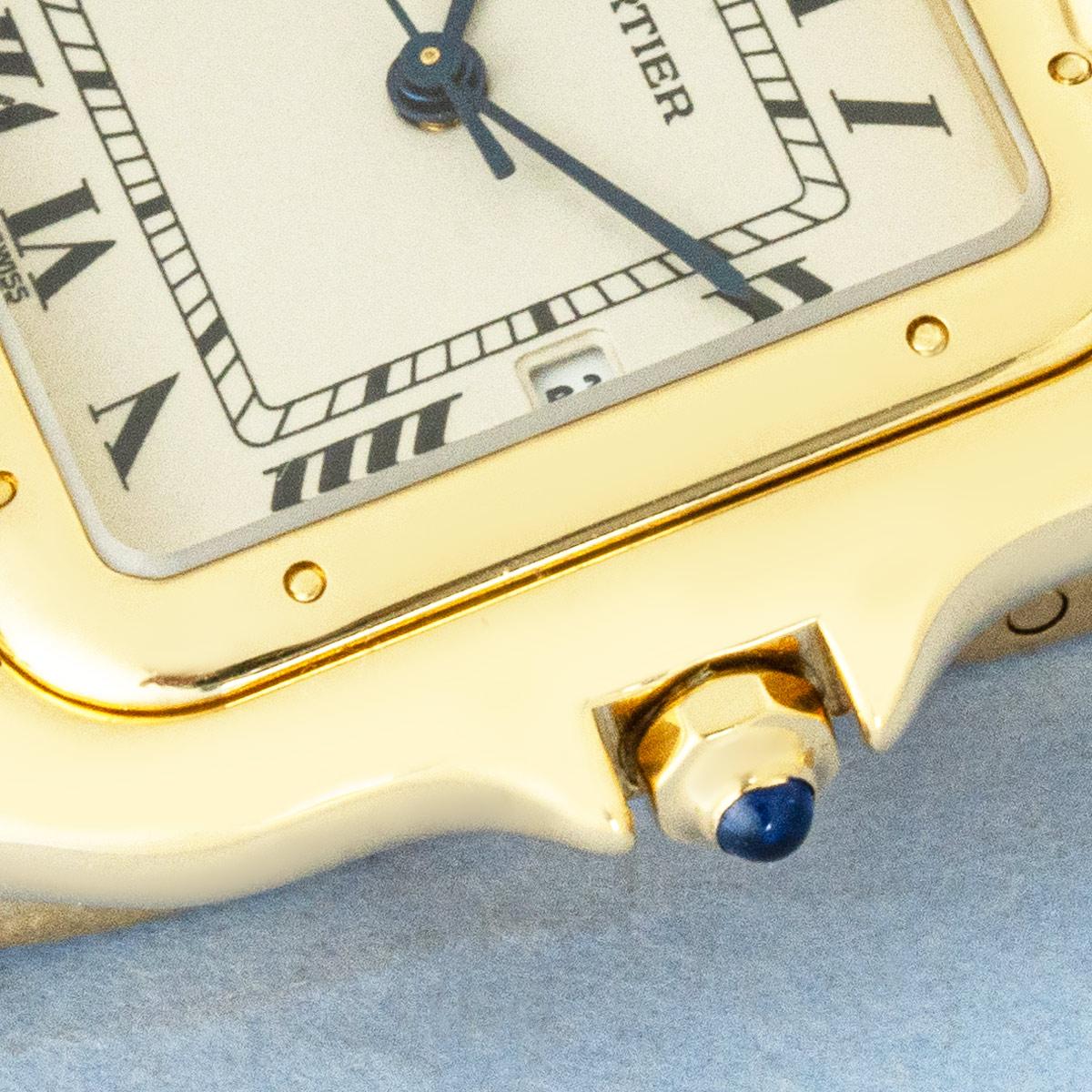 A rare jumbo/large size Cartier Panthère wristwatch crafted in 18k yellow gold. Featuring a silver dial with a date display, Roman numerals, blued-steel sword-shaped hands, and a discreet Cartier signature at VII.

Fitted with sapphire crystal and a