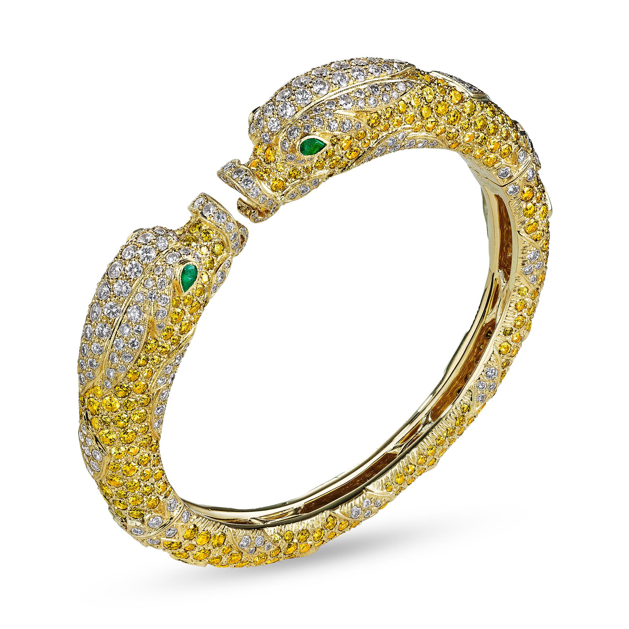 This Cartier Paris 'Chimera' hinged bracelet is rare, imaginative, and has a magical soul.   Designed in the 1970's, this fantastical once-in-a-lifetime jewel looks like it is on fire when placed on your wrist or in your hand.  Composed of vivid