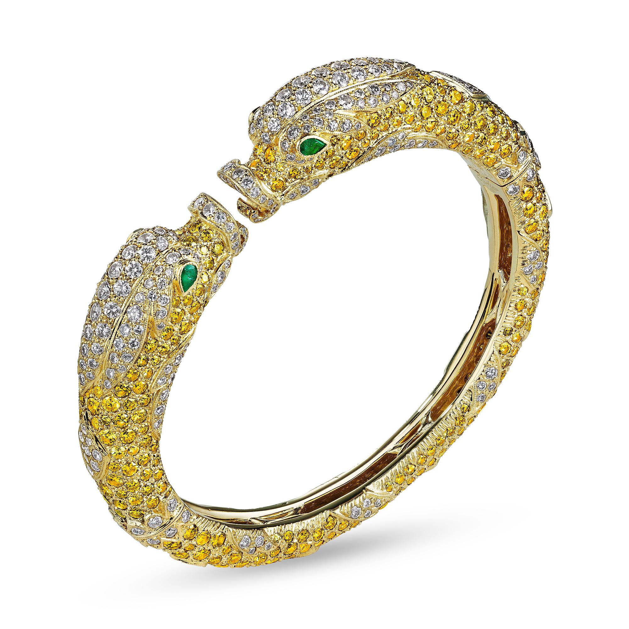 This Cartier Paris 'Chimera' hinged bracelet is rare, imaginative, and has a magical soul.   Designed in the 1980's, this fantastical once-in-a-lifetime jewel looks like it is on fire when placed on your wrist or in your hand.  Composed of vivid