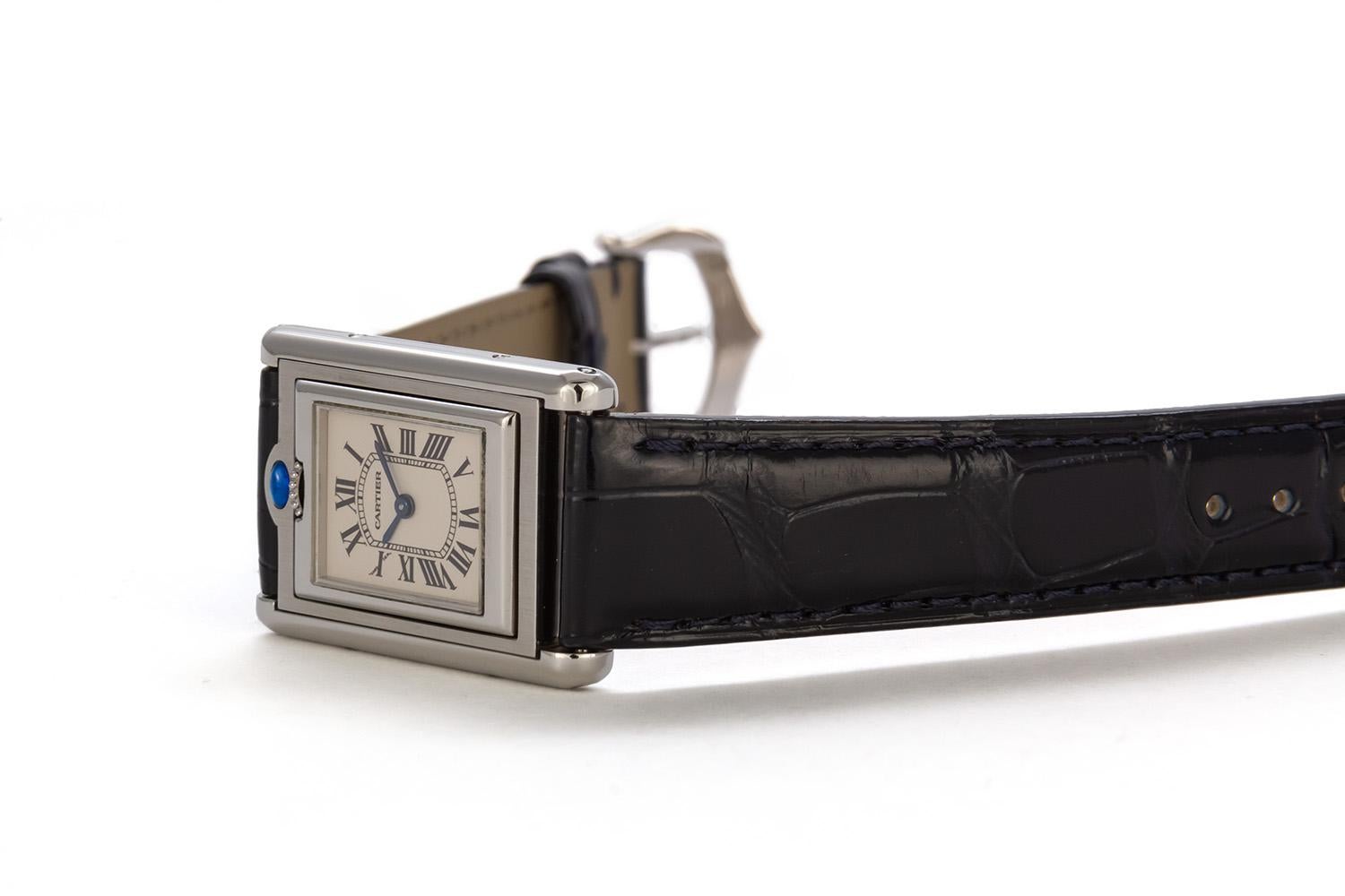 We are pleased to offer this Authentic Rare Cartier Stainless Steel Ladies Basculante Watch (Ref. 2386). This Cartier Basculante watch features a Swiss-made quartz movement; white dial with black Roman numerals and blued-steel, sword-shaped hands;