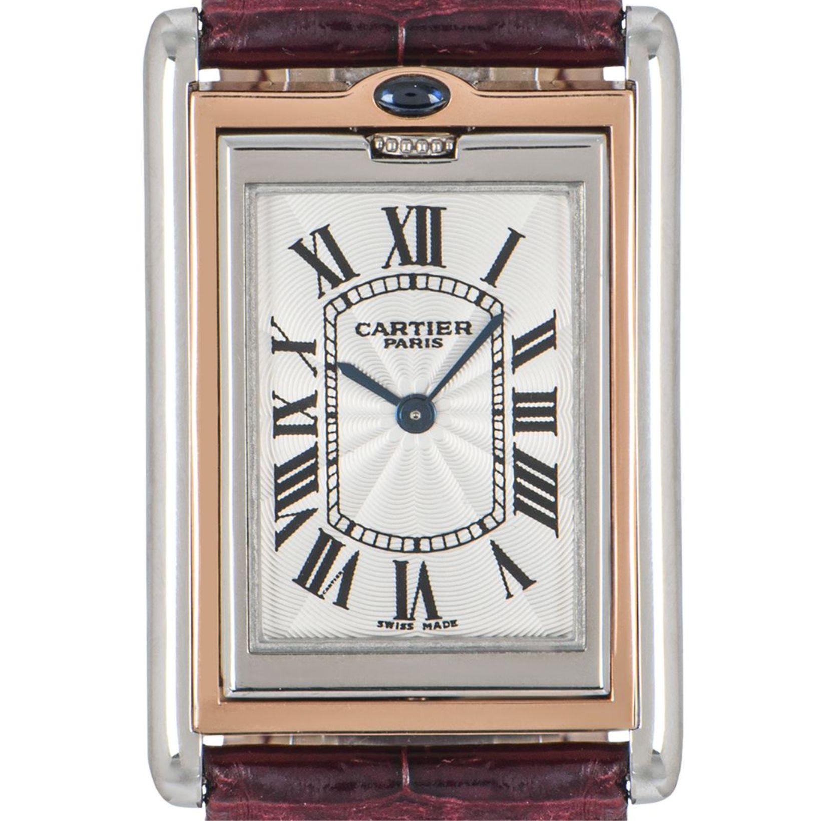 A rare, platinum and rose gold Tank Basculante by Cartier. Featuring a silver guilloche dial with roman numerals, blued steel sword-shaped hands, a hidden Cartier signature at VII and a reversible case featuring an exhibition case back.

Fitted with