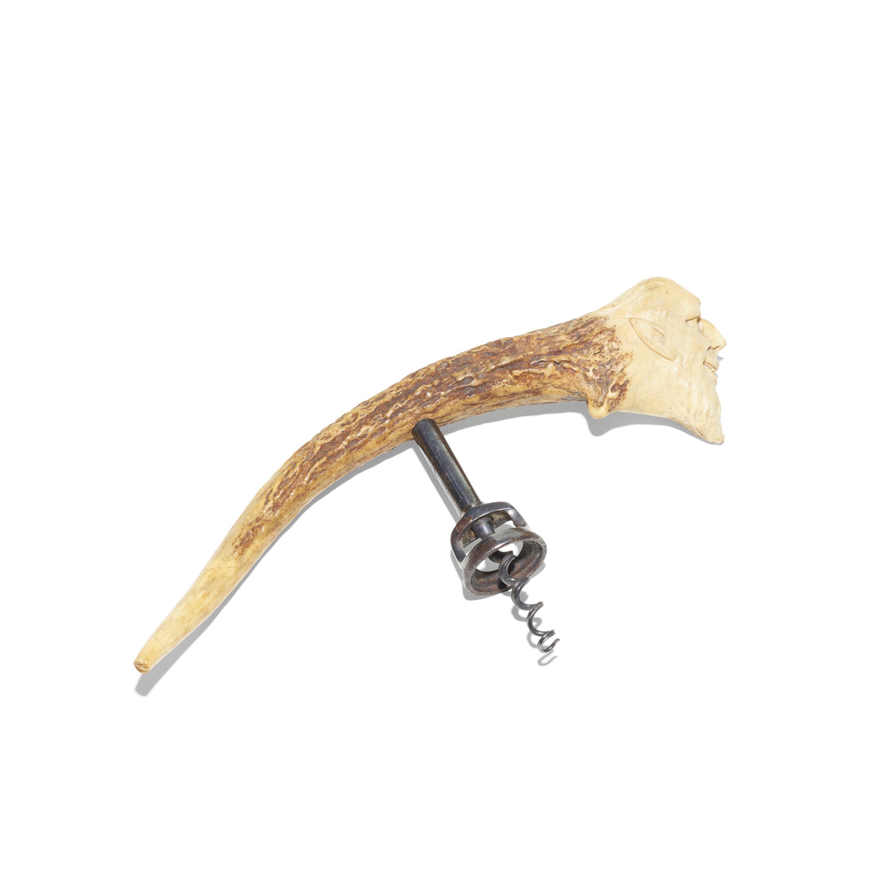 Rare corkscrew made of horn on the upper part and metal on the lower part, measuring 5'' by 9'' by 1''. The figural motif is highly realistic. 

 