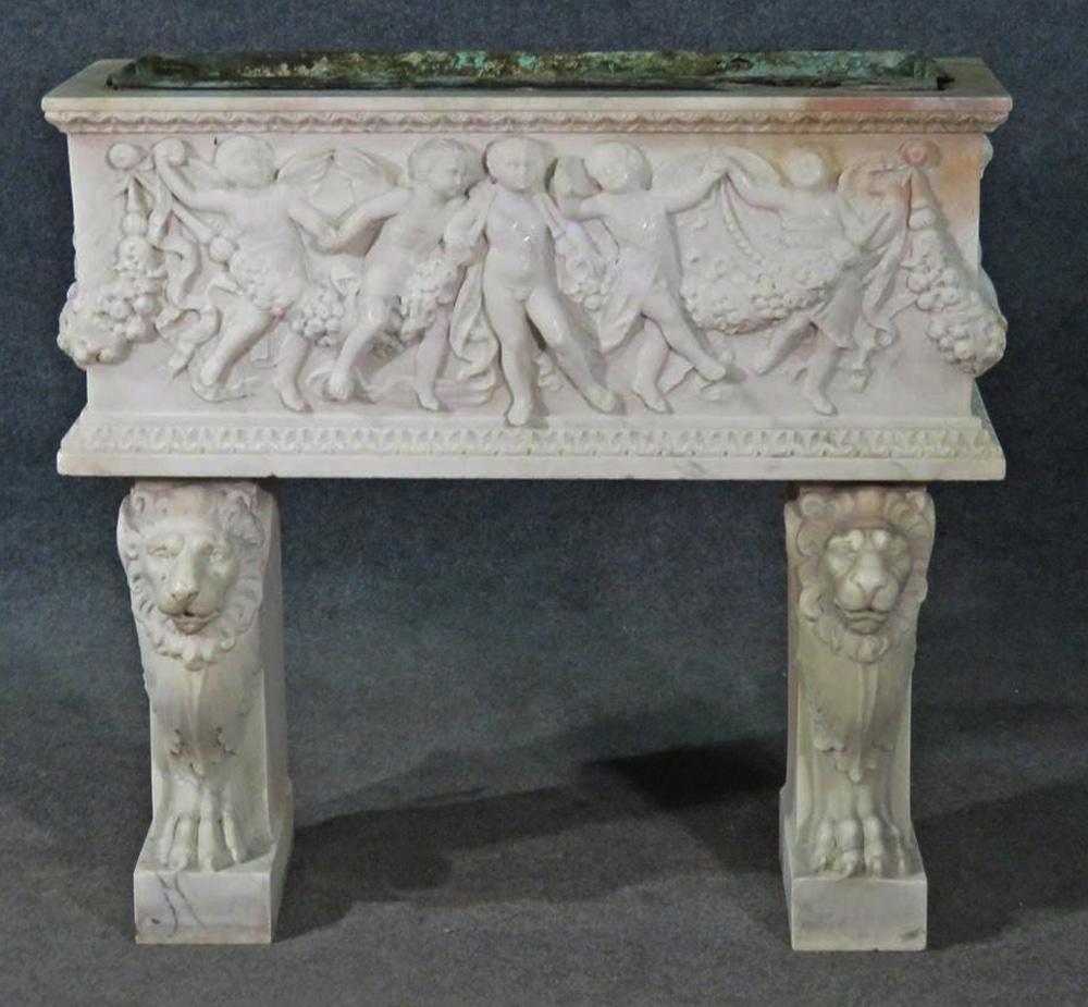 This is a super-rare find. This incredible carved carrara marble Italian planter dates to the late 1880s and has patina and normal age-related minor cracks, and signs of oxidation but this is to be expected and even desired. The meticulous carving